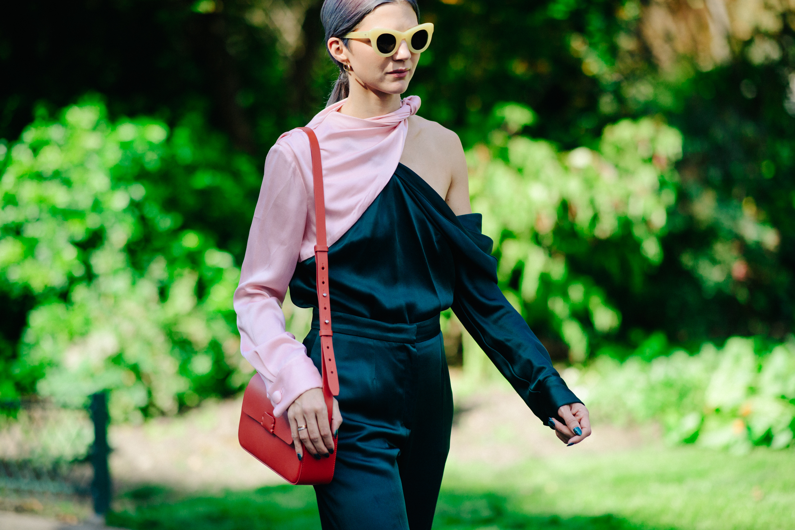 Woman wearing green and pink