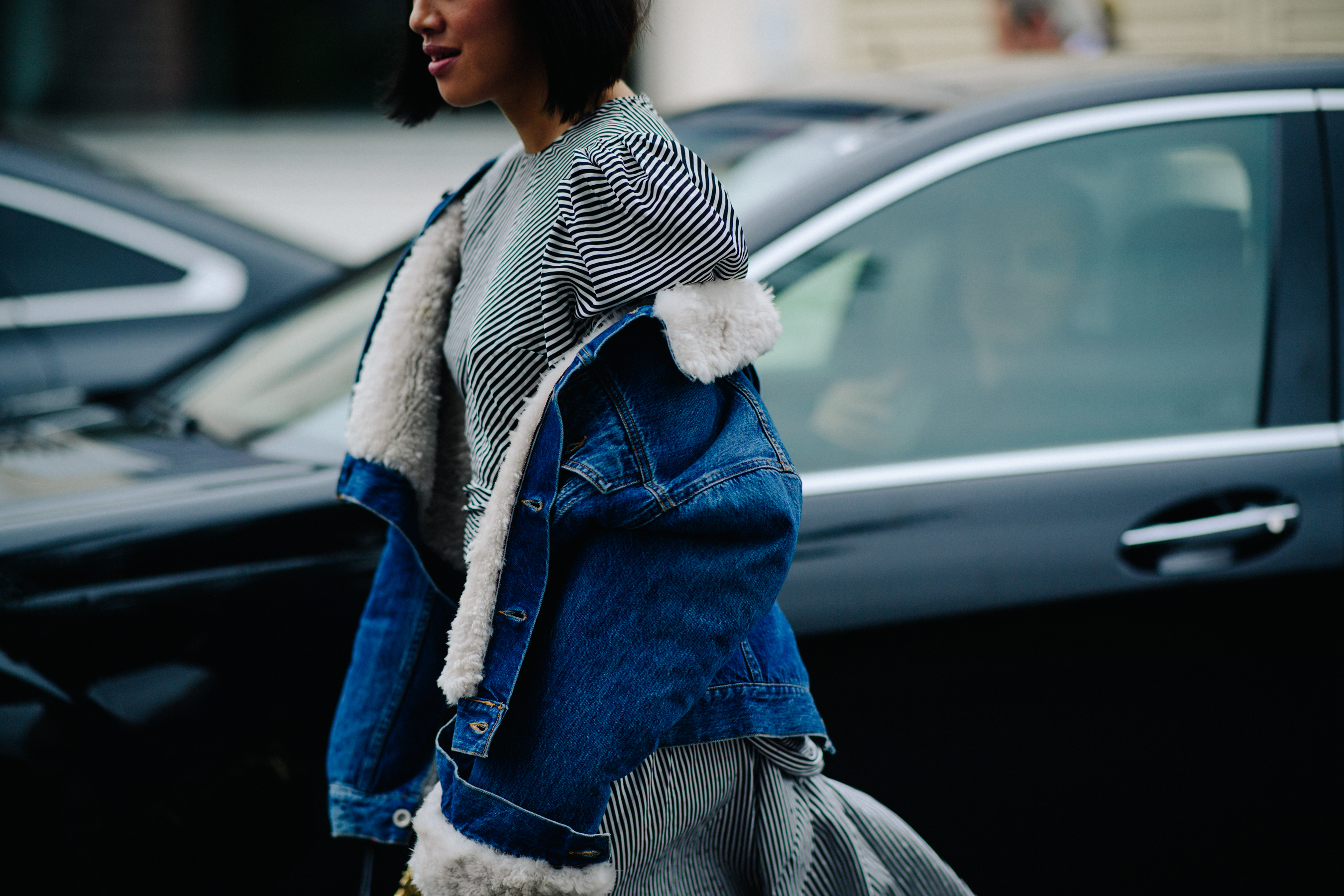 Woman wearing denim shearling coat