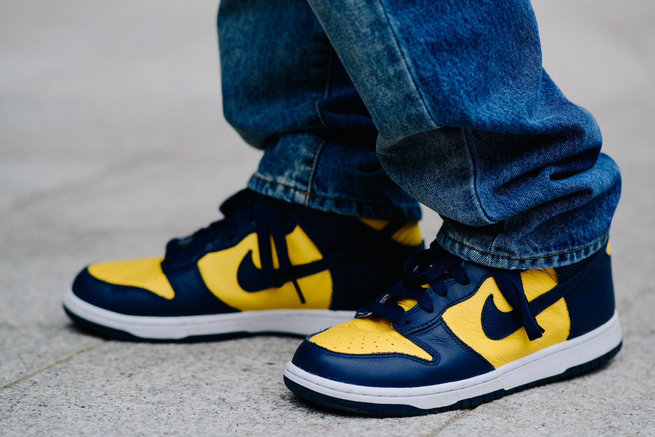 Closeup of yellow and blue Nike shoes