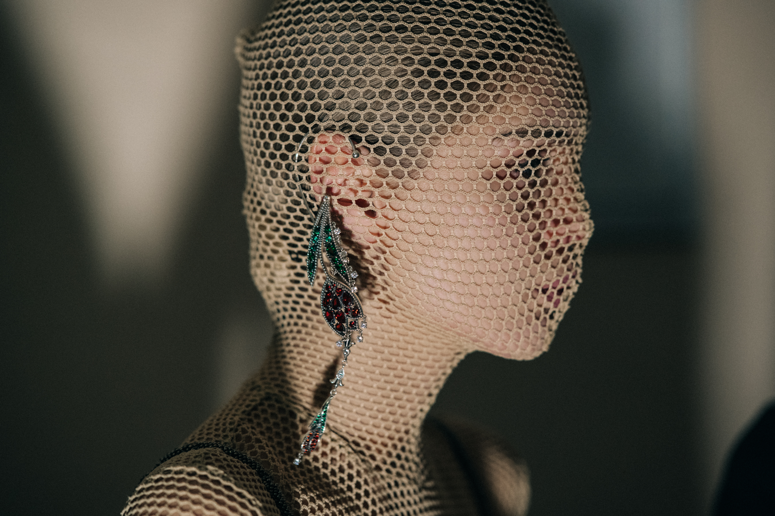Model wearing net hood backstage
