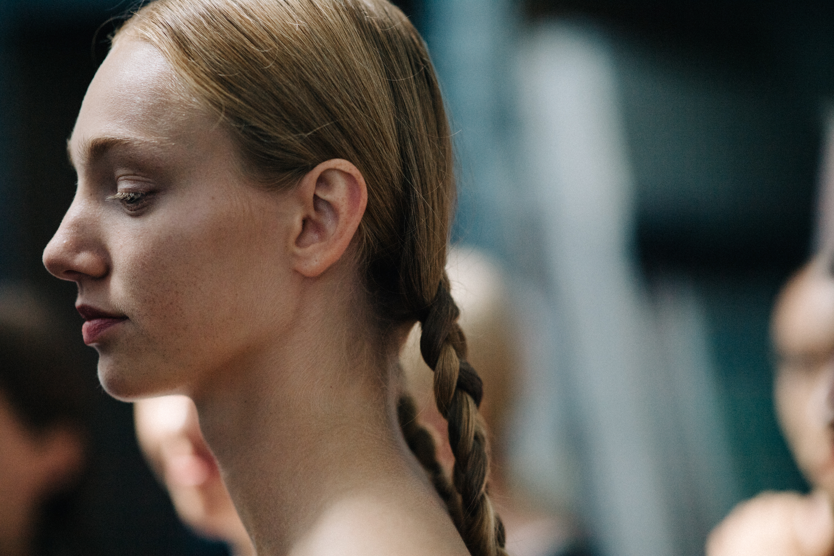 Models with braided hair before a show