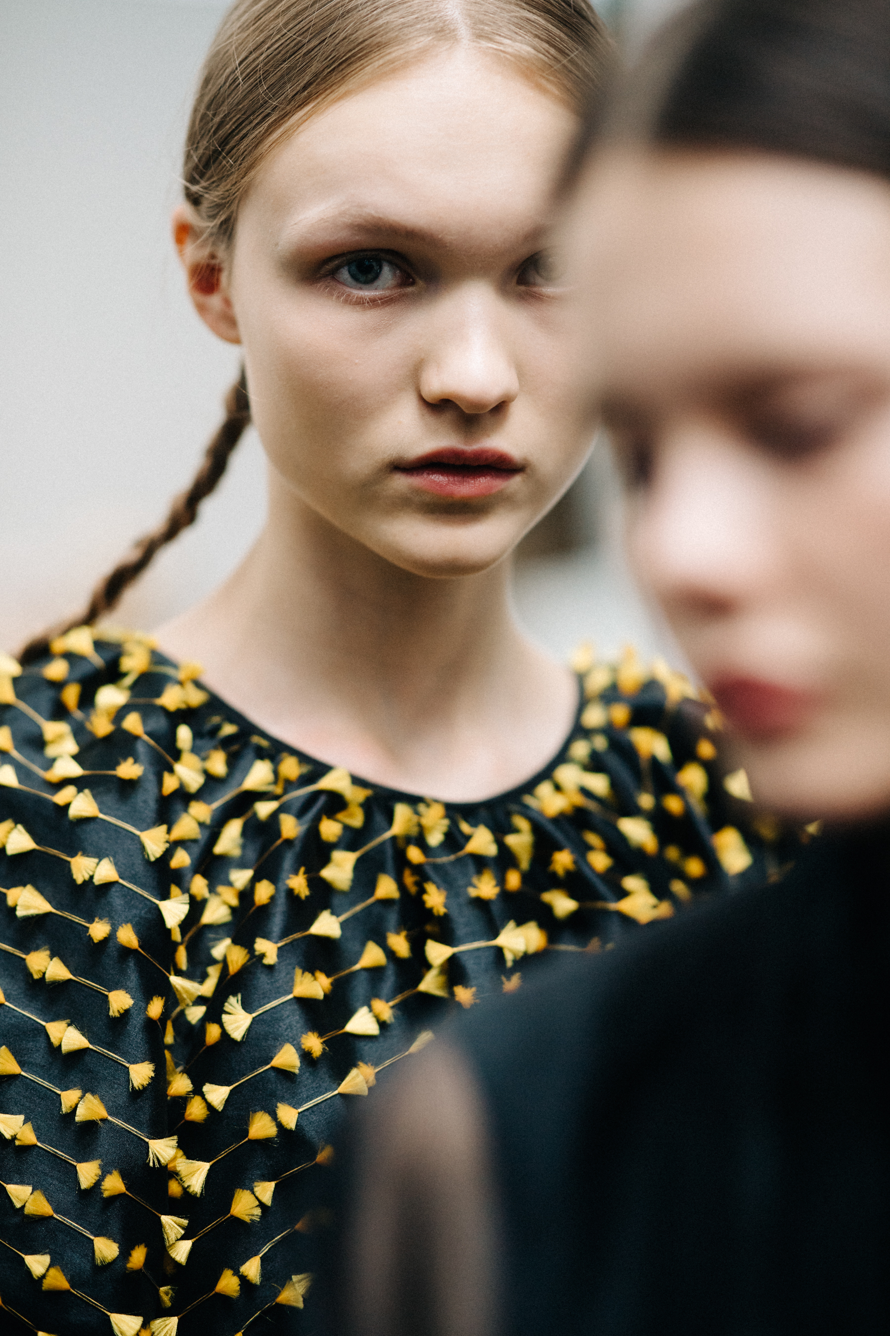 Model with braided hair before a show