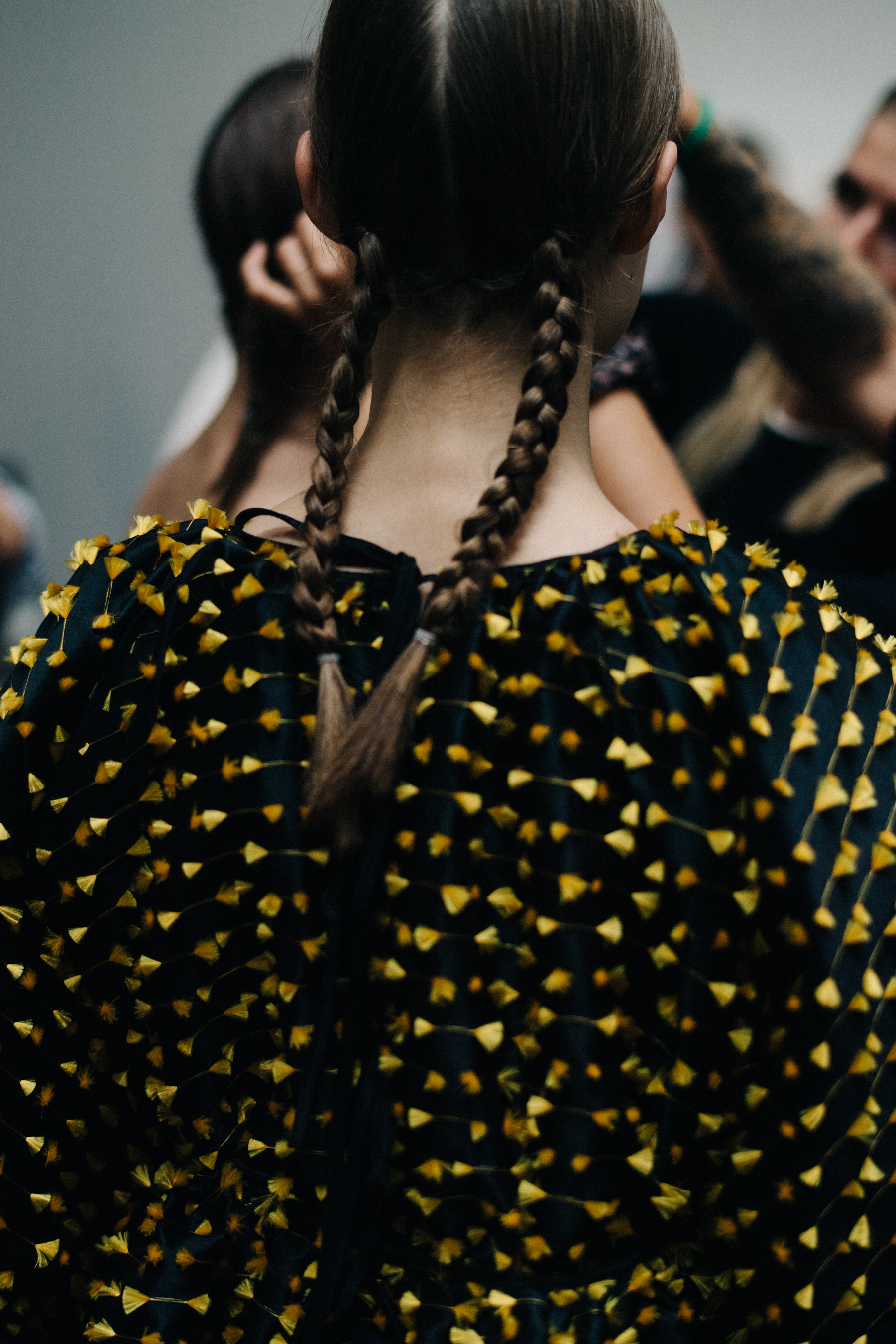 Model with braided hair before a show