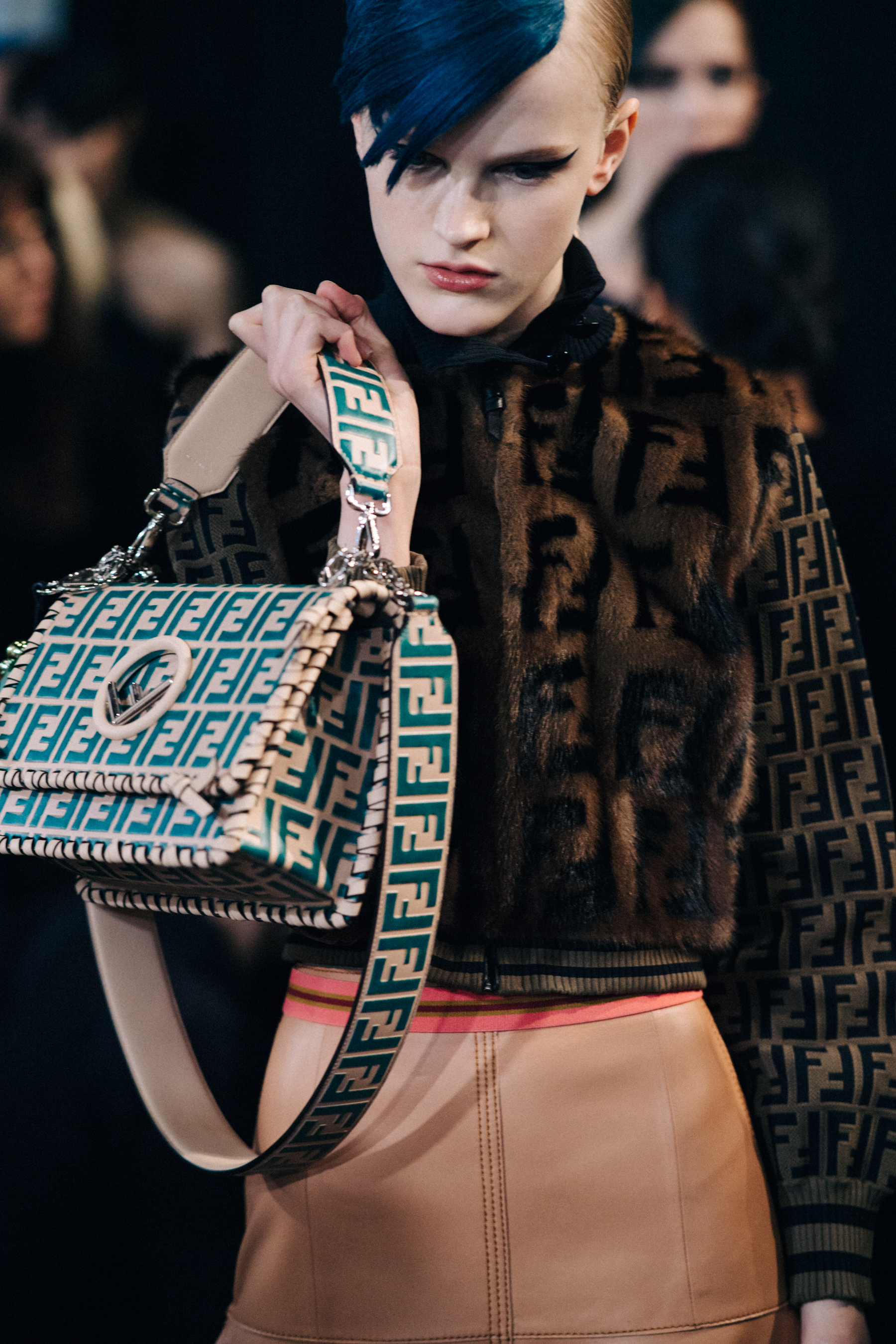 Closeup of Fendi handbag held by model