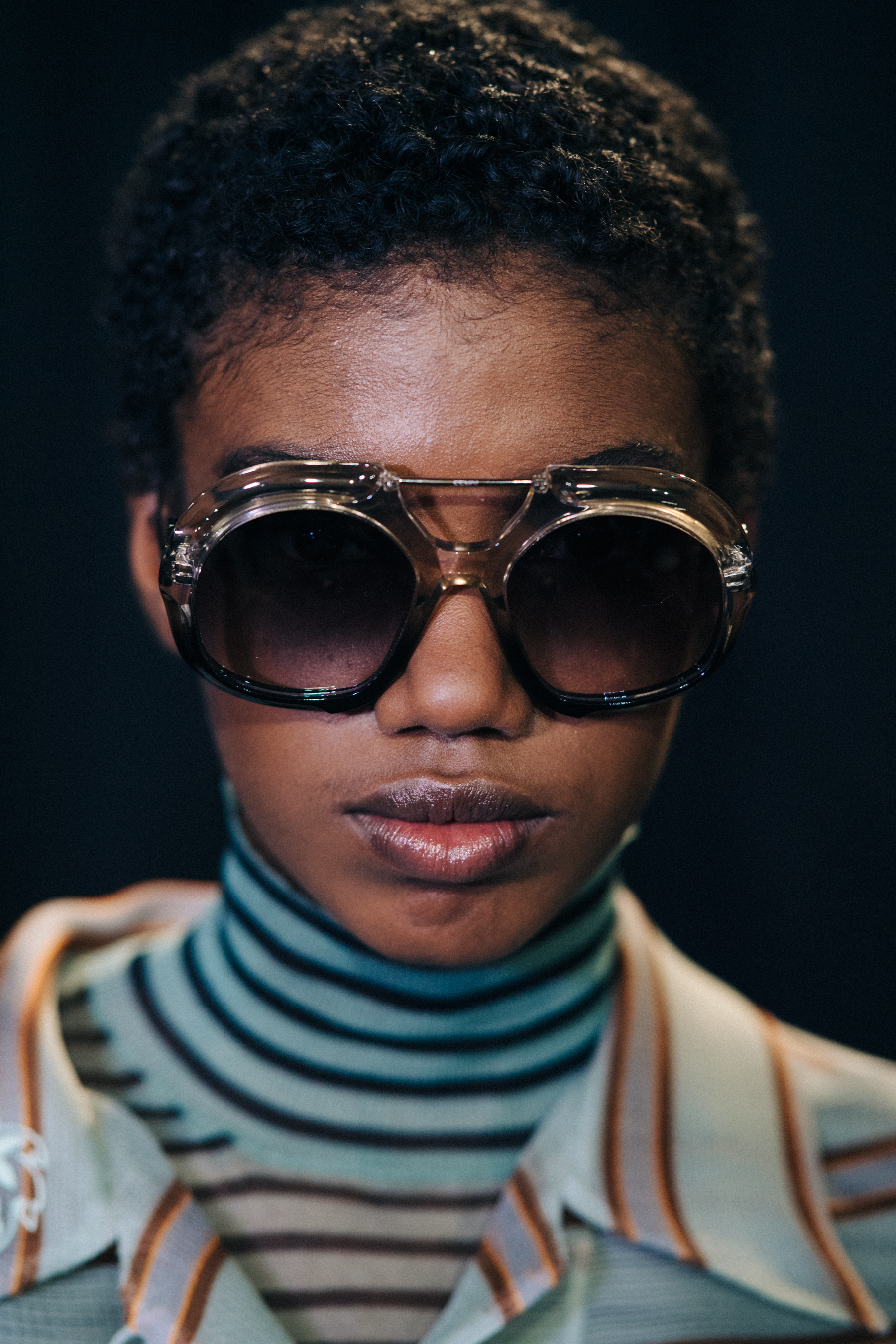 Portrait of black model wearing dark sun glasses