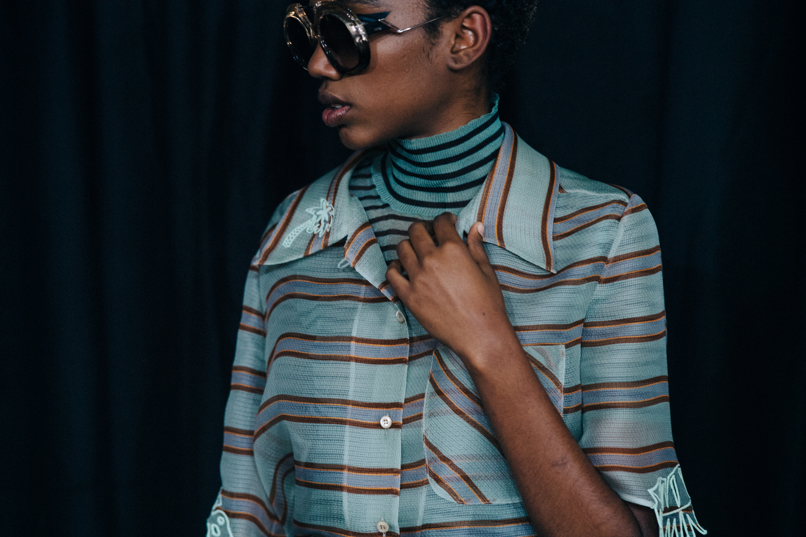 Closeup of model in Green striped top