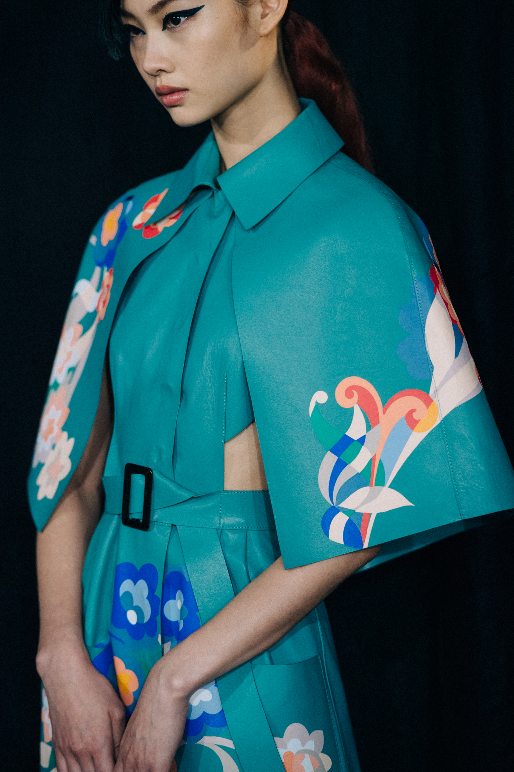 Model with blue pattern outfit