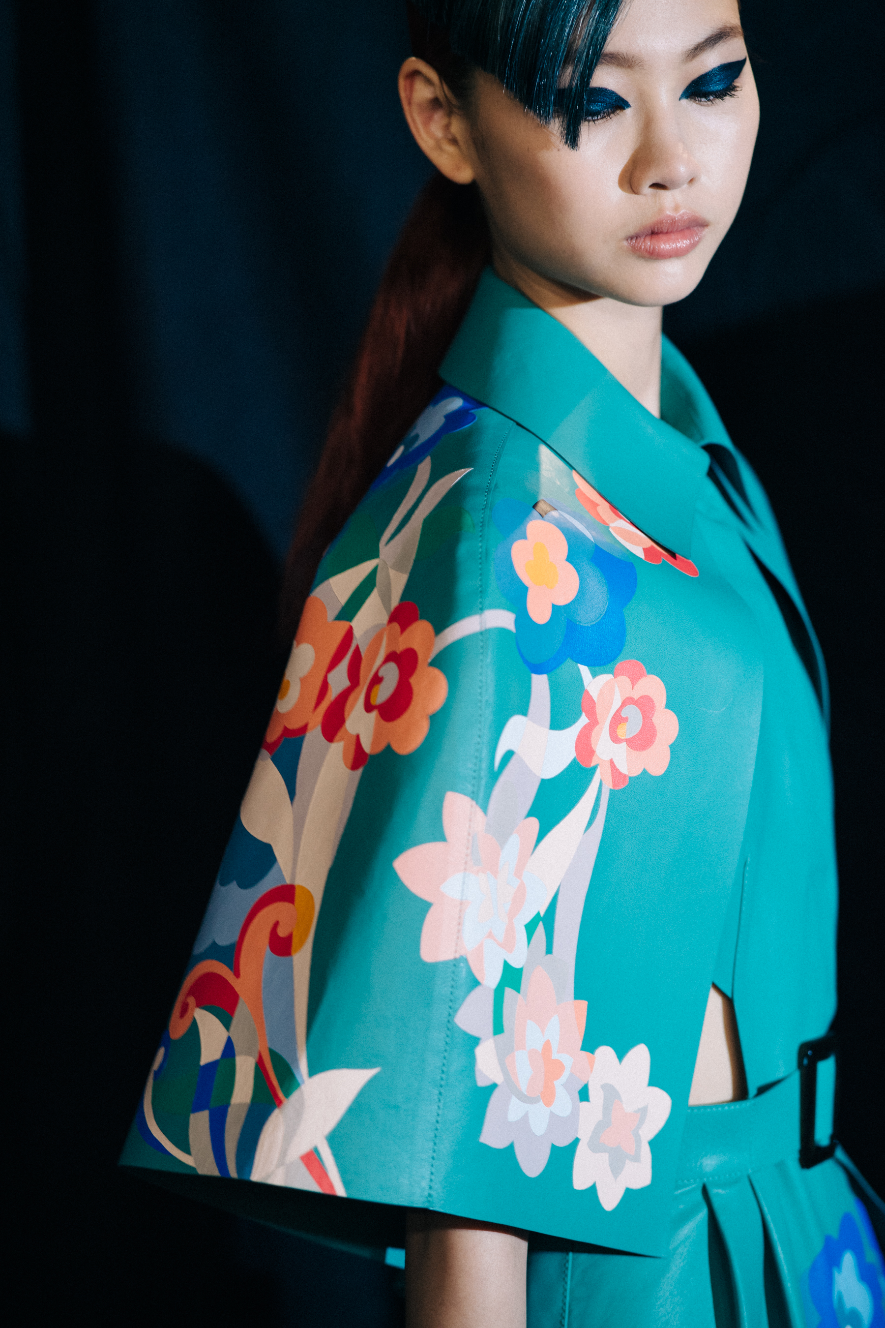 Model with blue pattern outfit