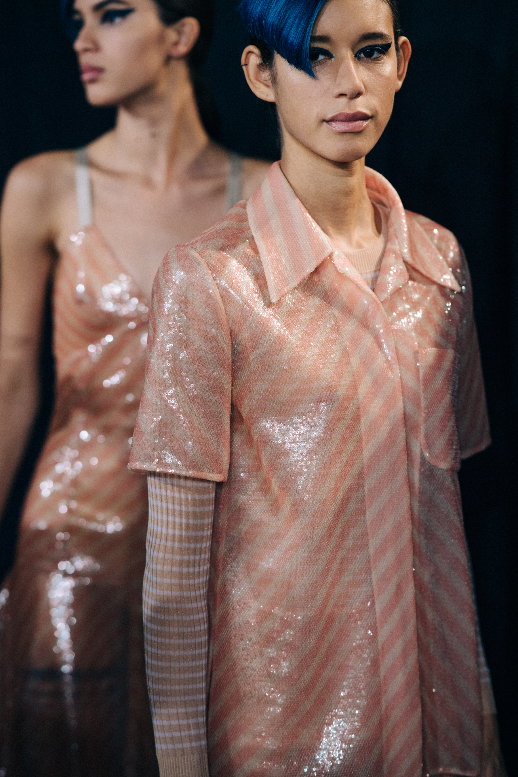Two models in pink striped outfit