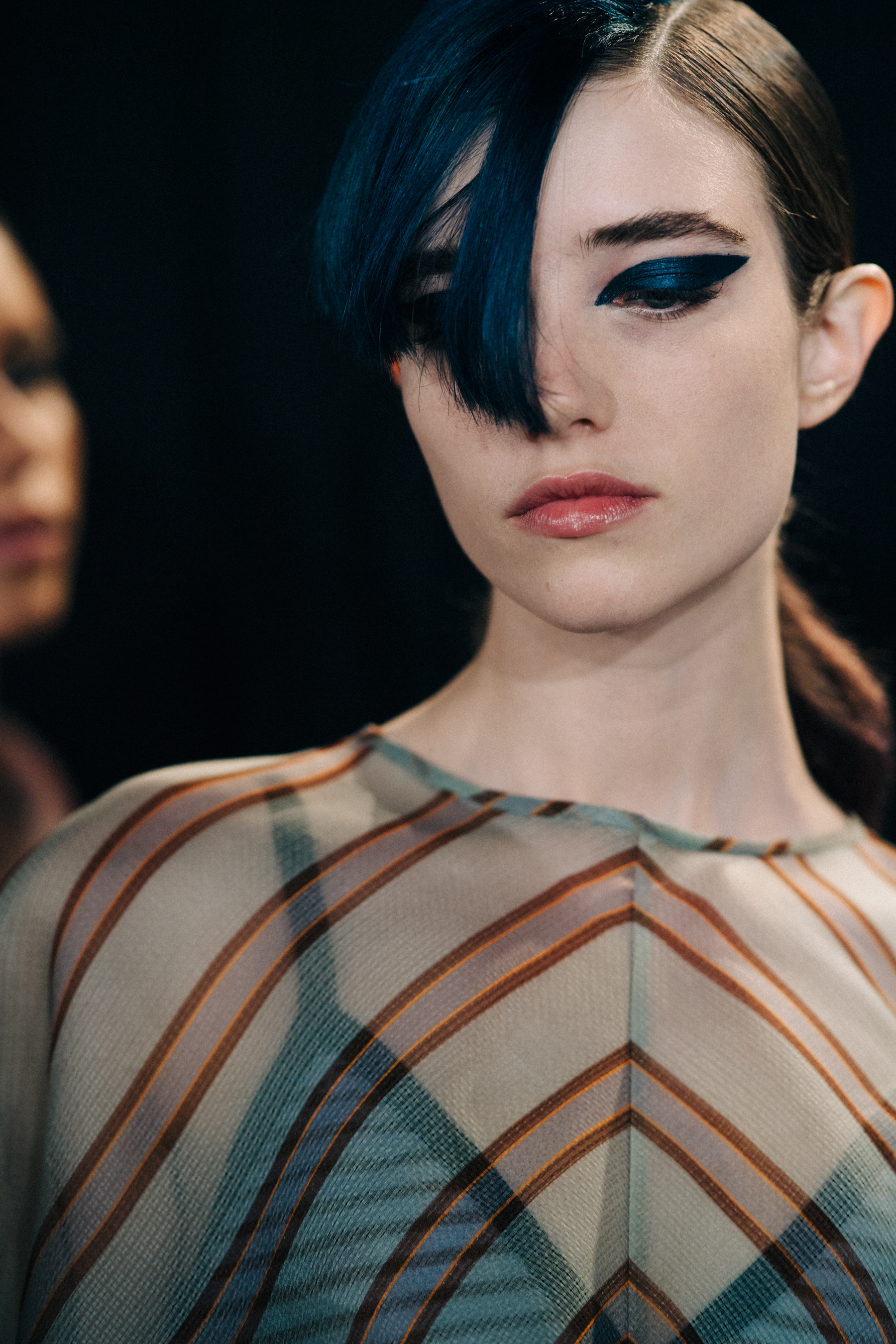 Closeup of model with blue fringe