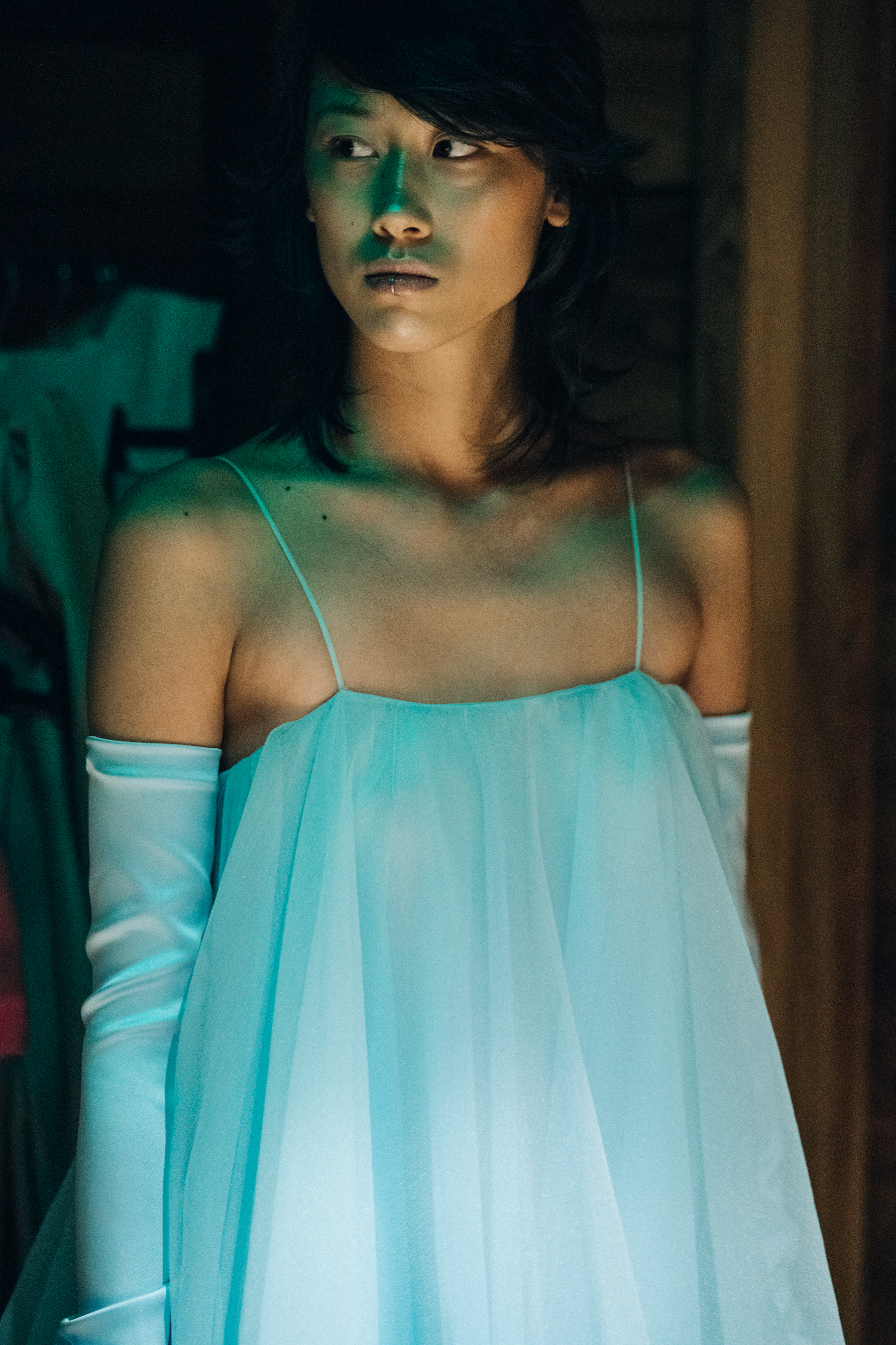 Model wearing blue top
