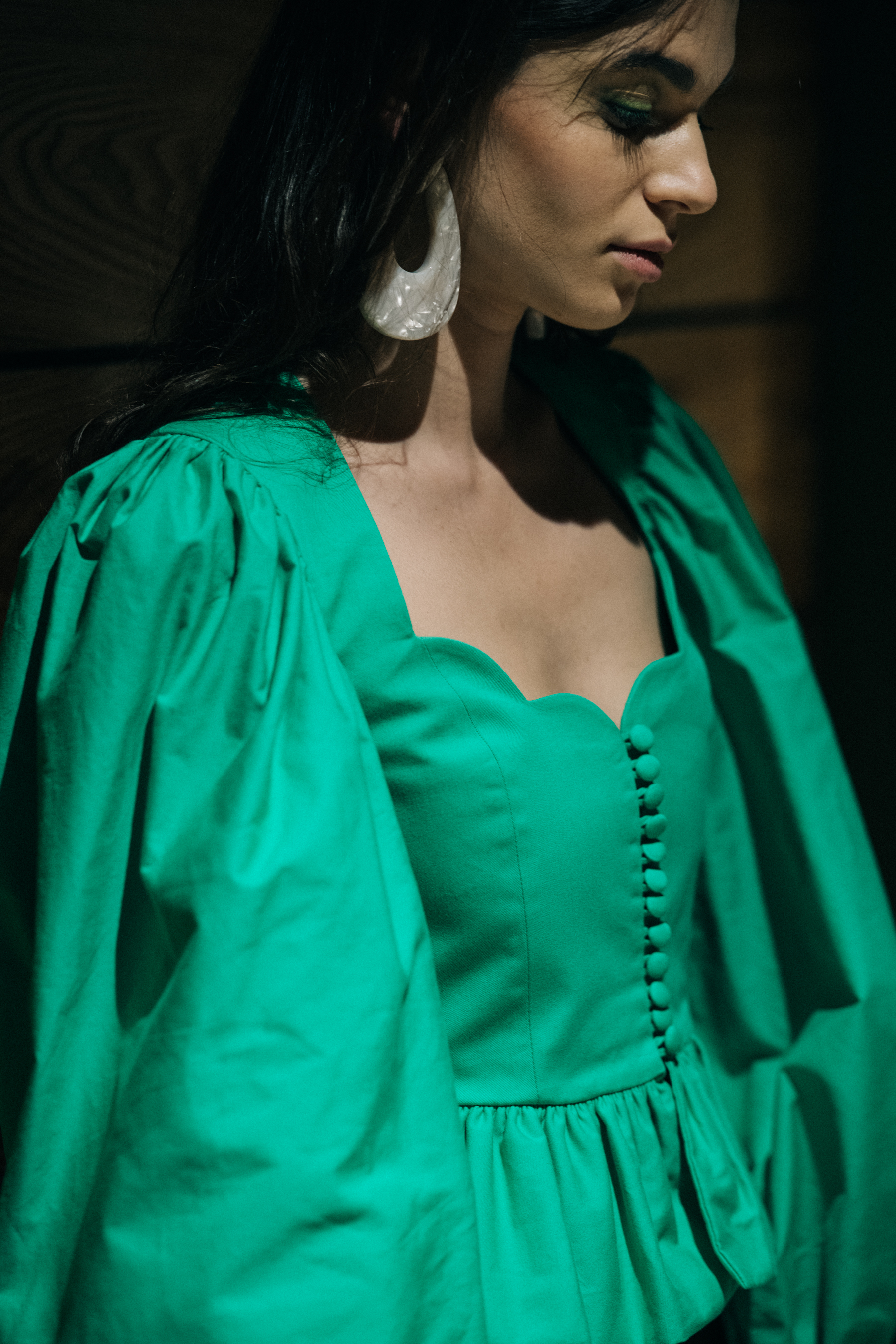 Model wearing green outfit