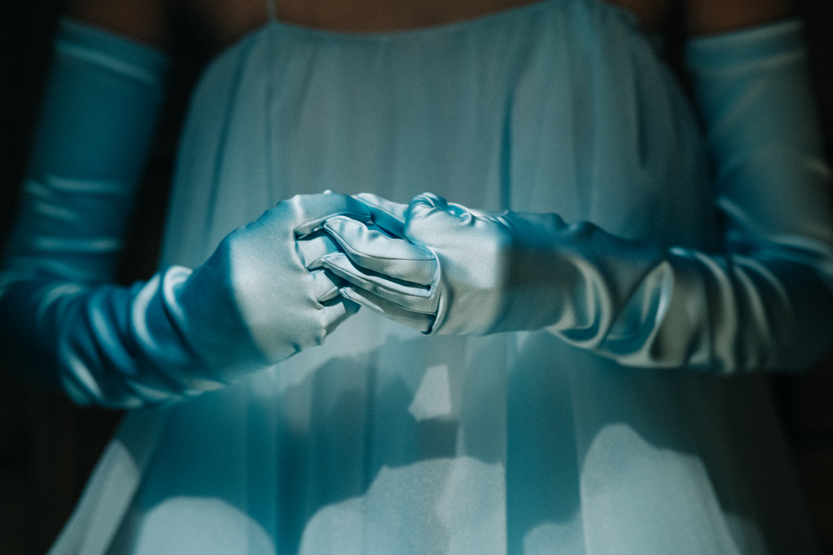 Model wearing blue gloves