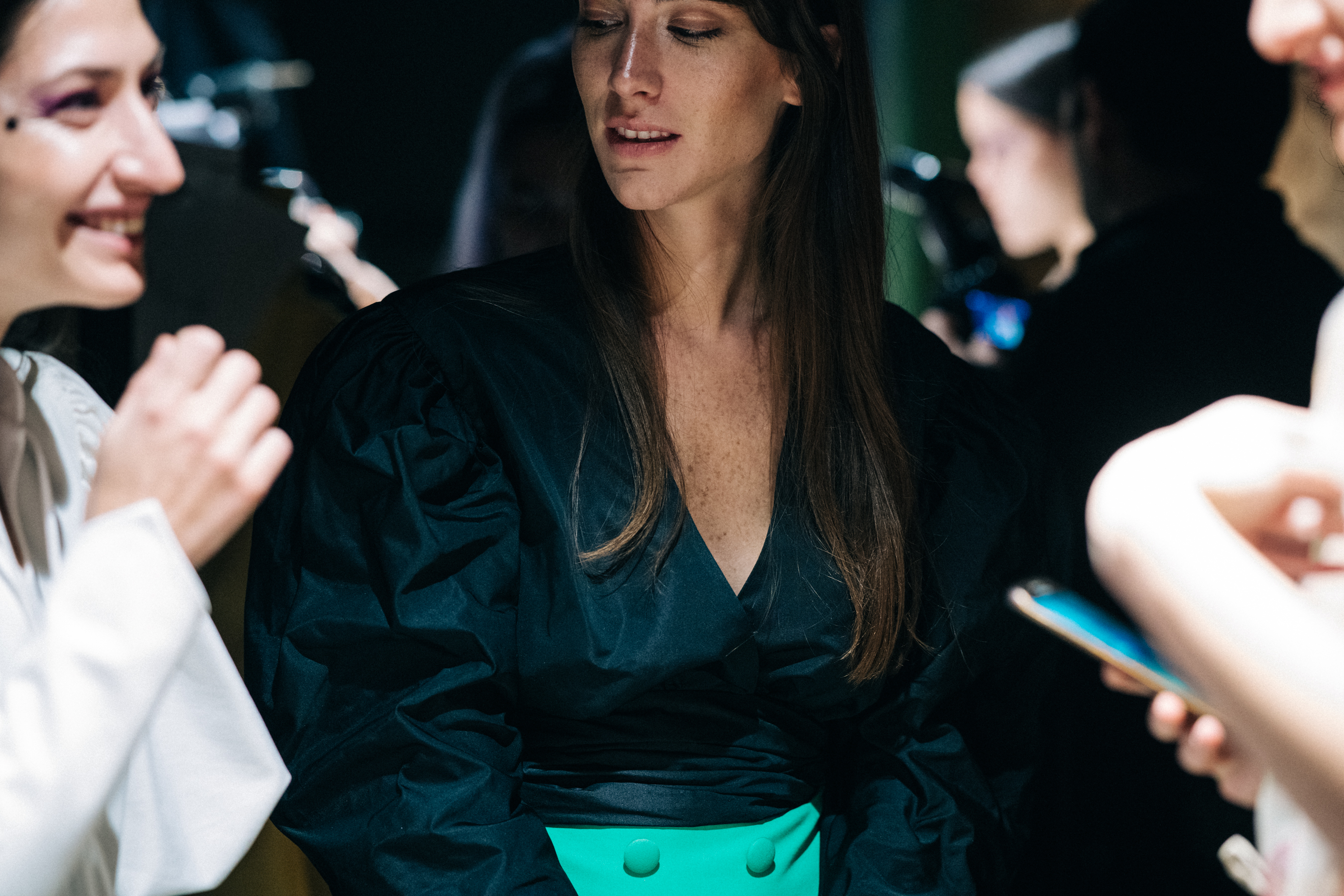 Model wearing black and green