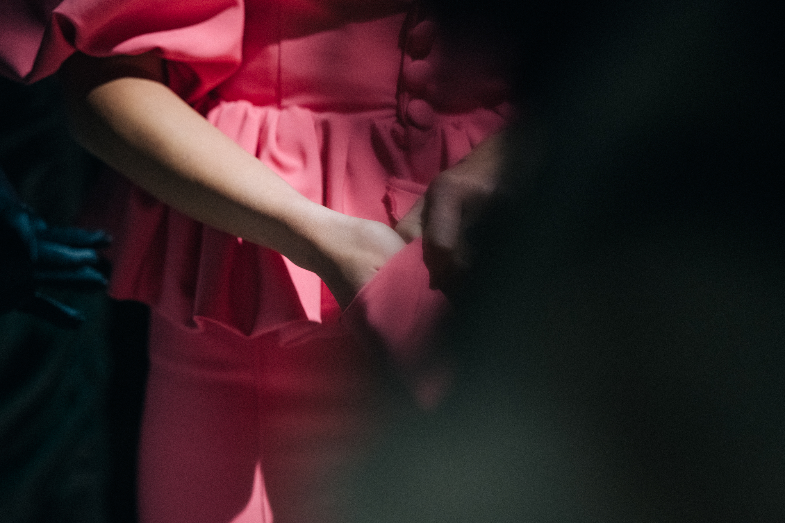 Model wearing pink gloves