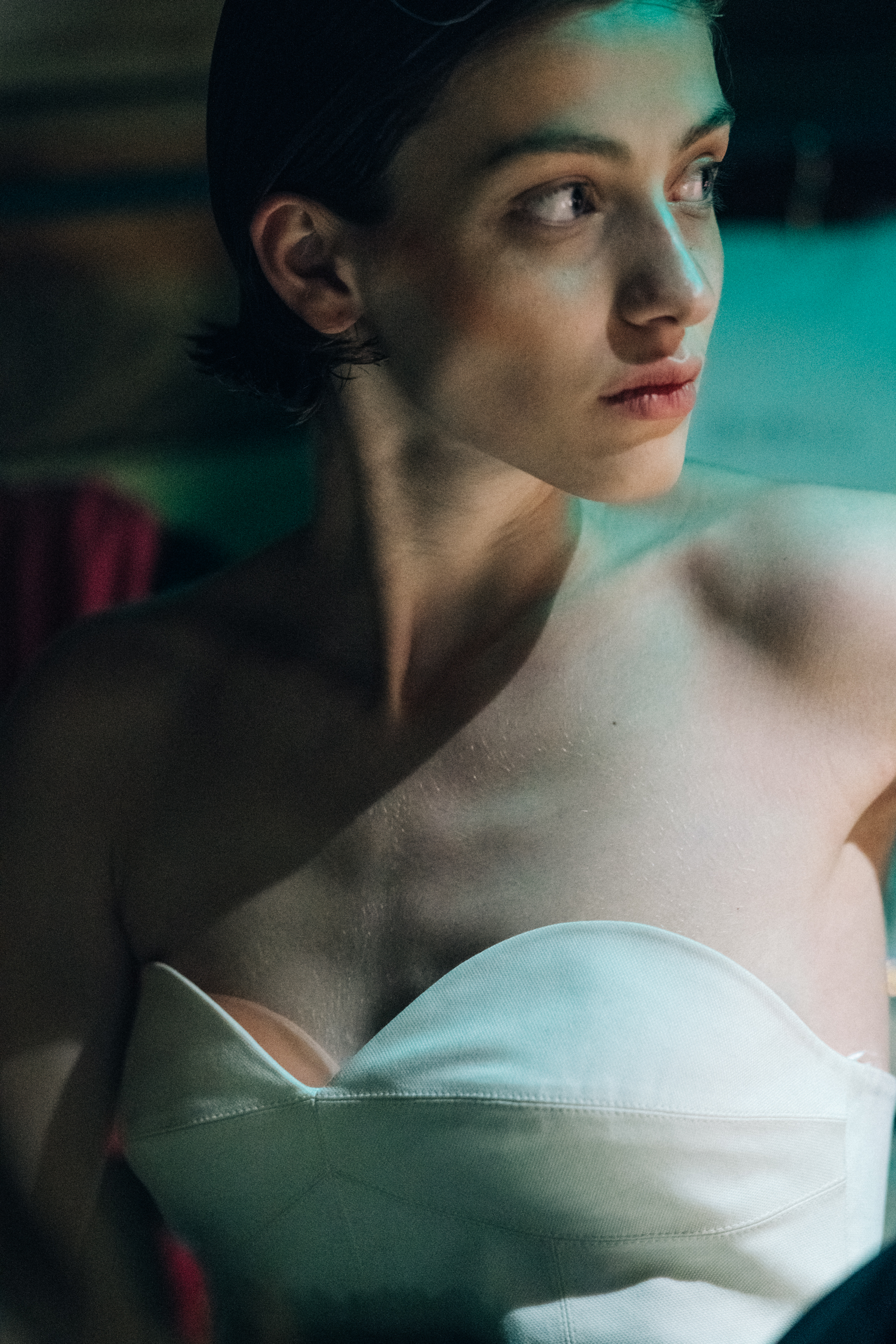 Model wearing white top
