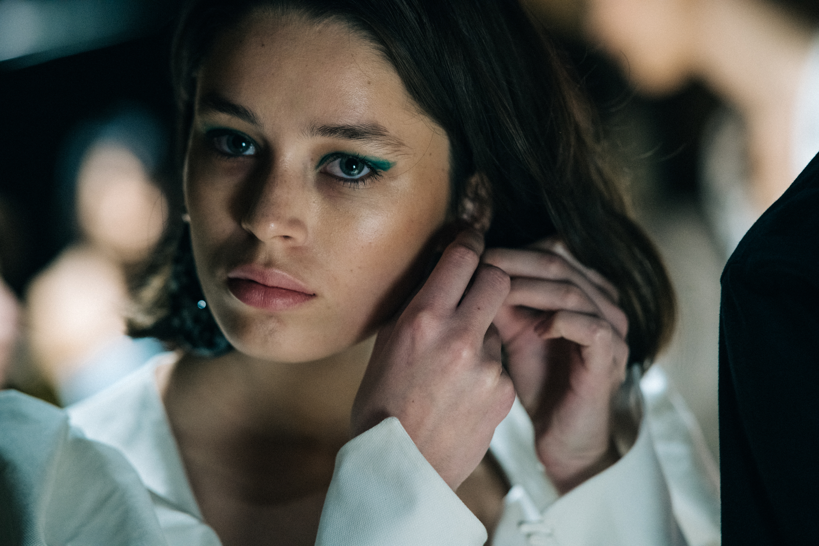 Model backstage with blue eyes
