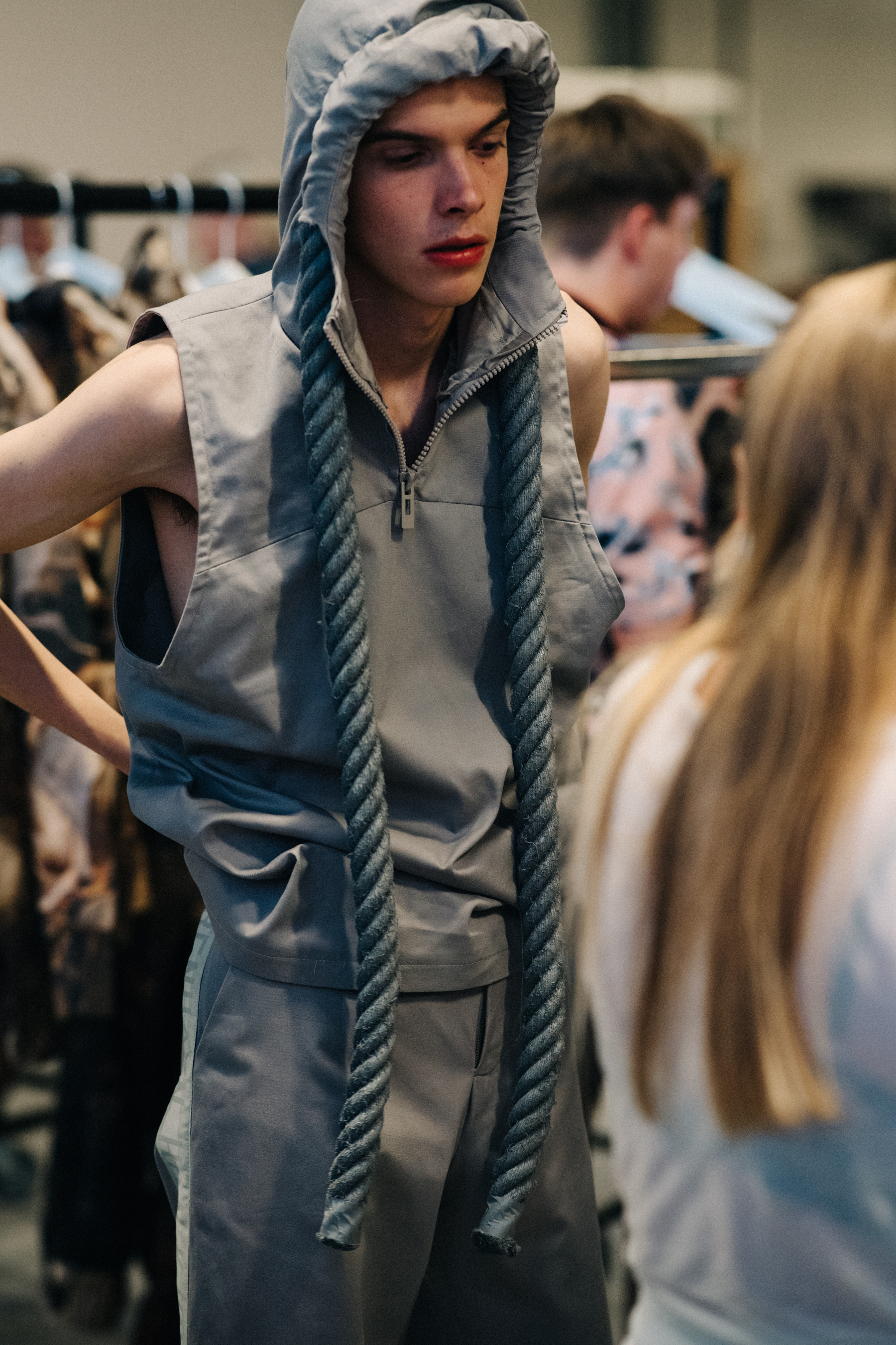 Male model getting dressed before a show