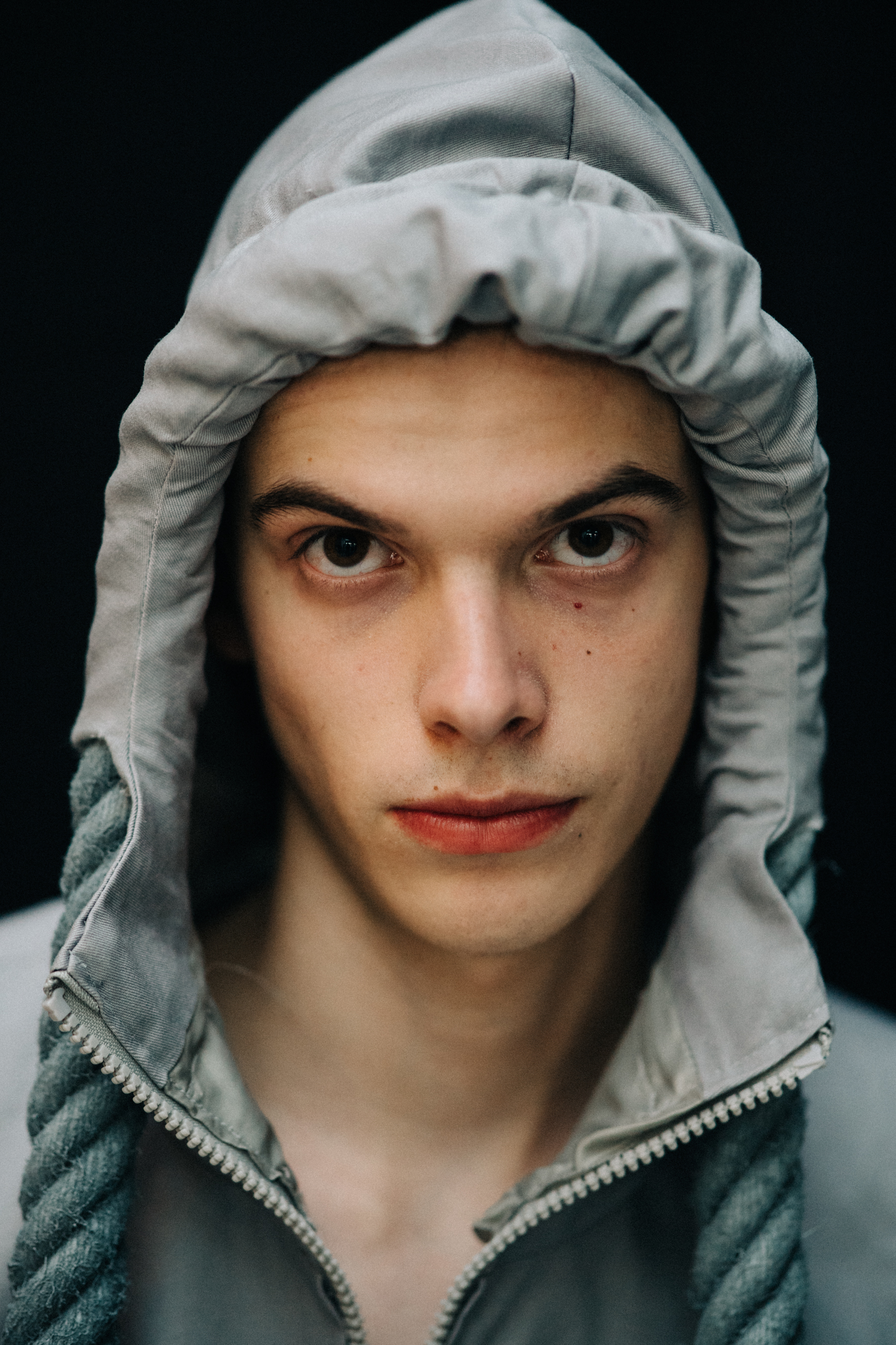 Portrait of a male model wearing a hood