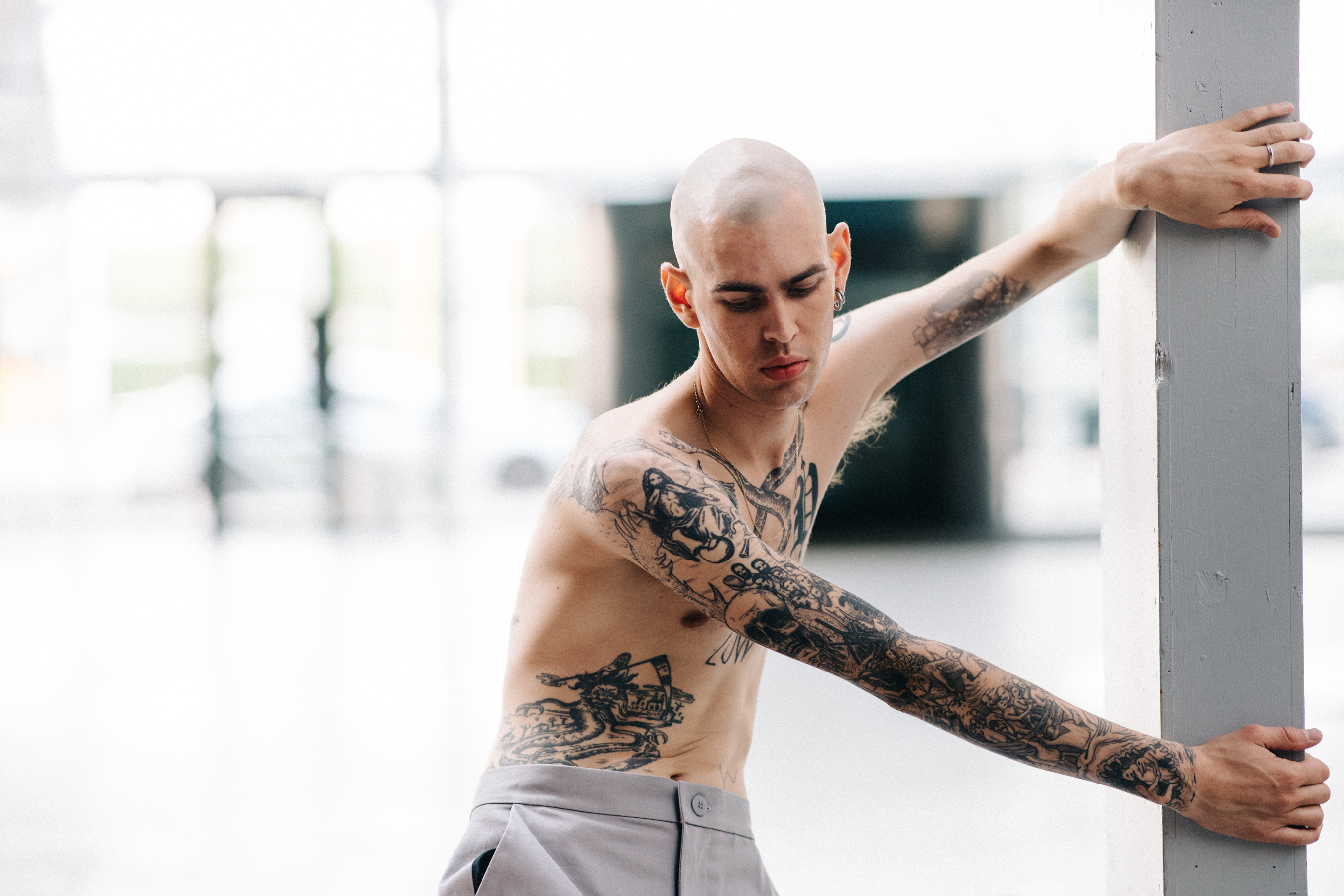Male model with tattoos before a show