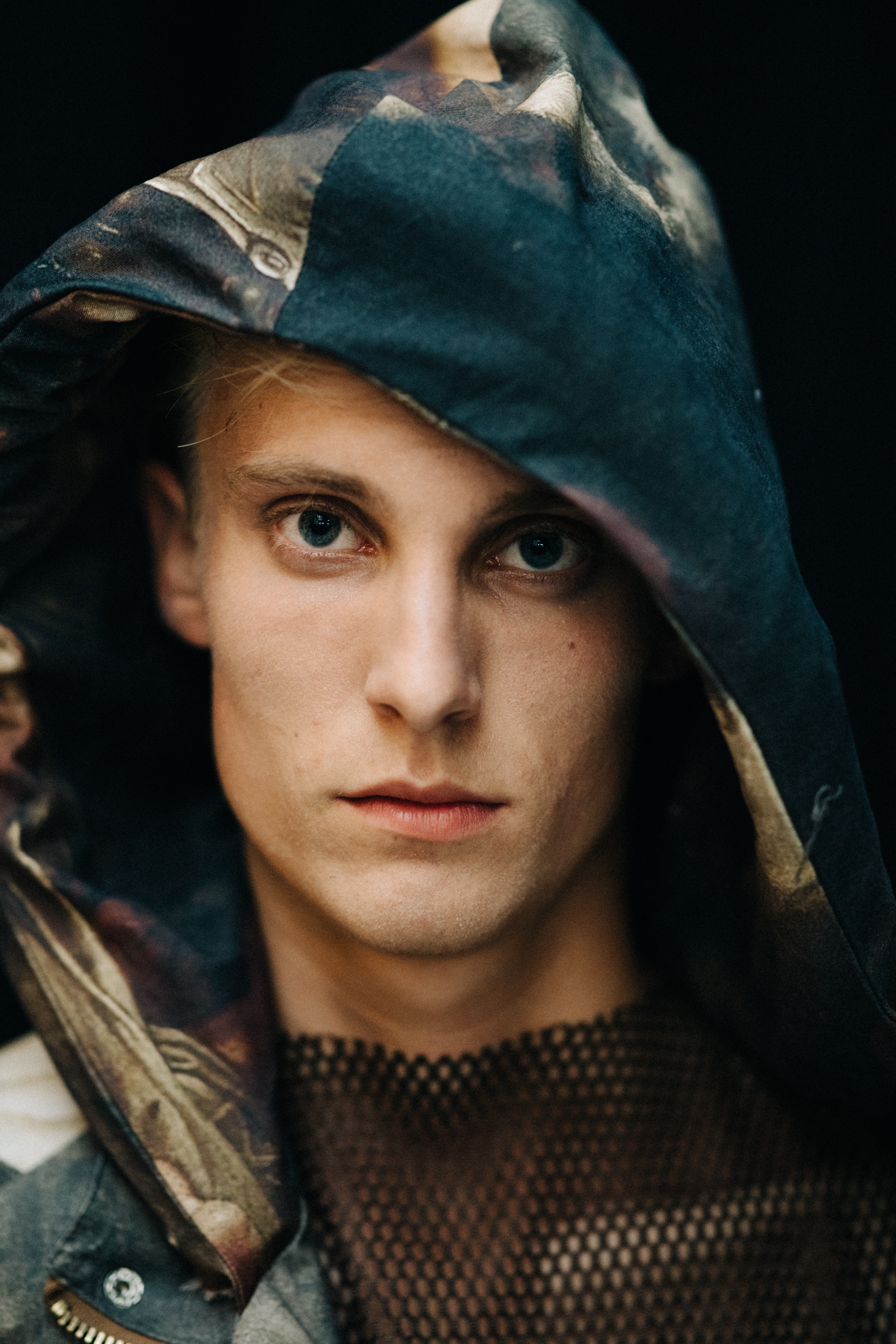 Portrait of a male model wearing a hood