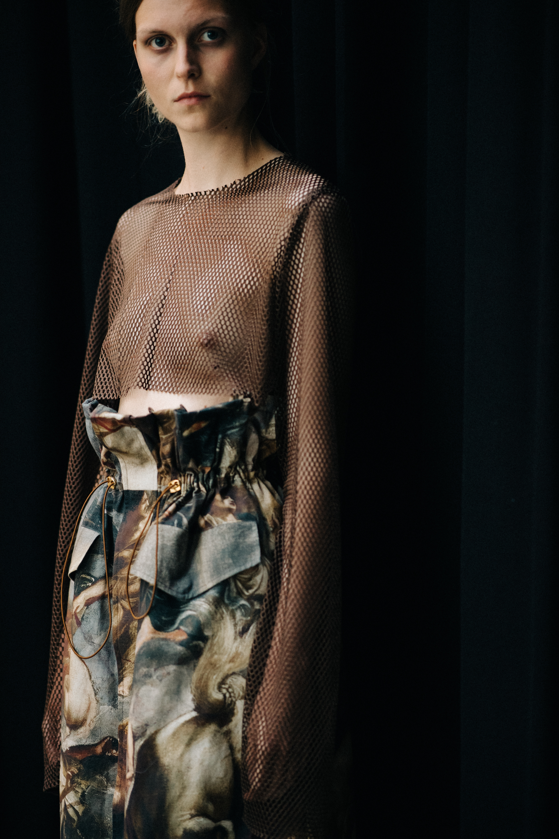 Model wearing outfit with classical painting prints