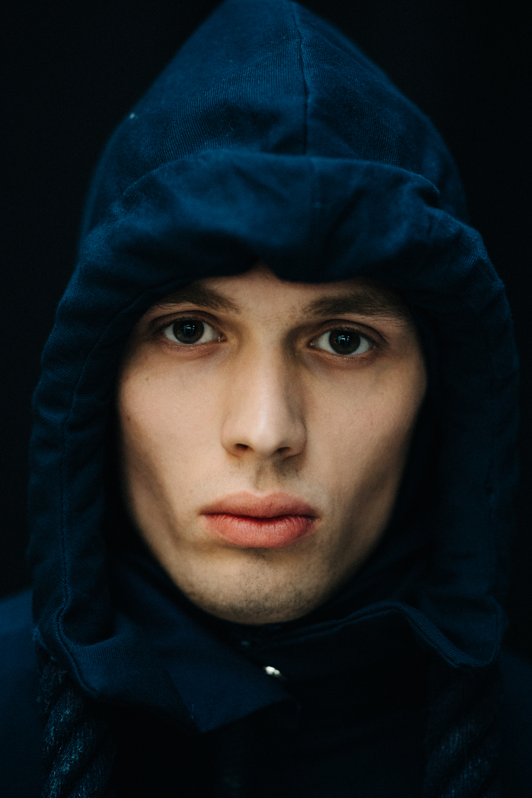 Portrait of a male model wearing a hood