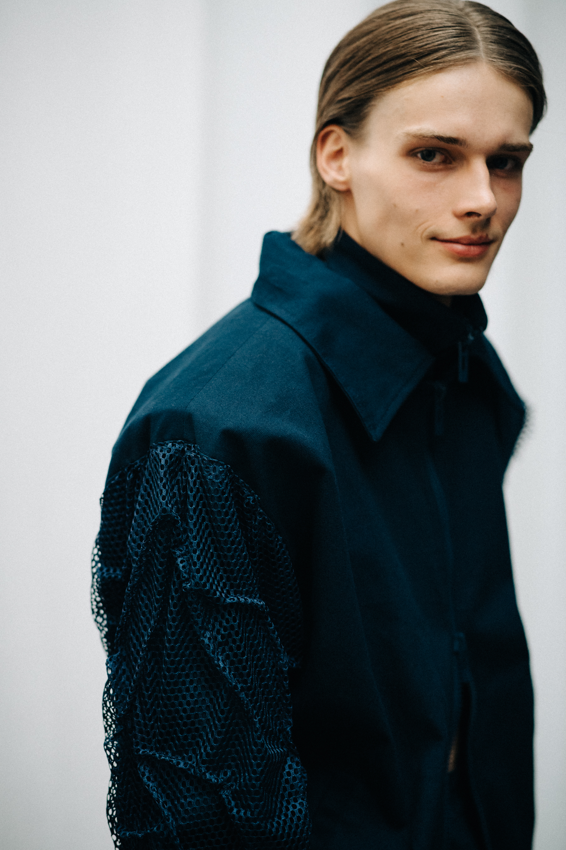 Model wearing blue workwear outfit