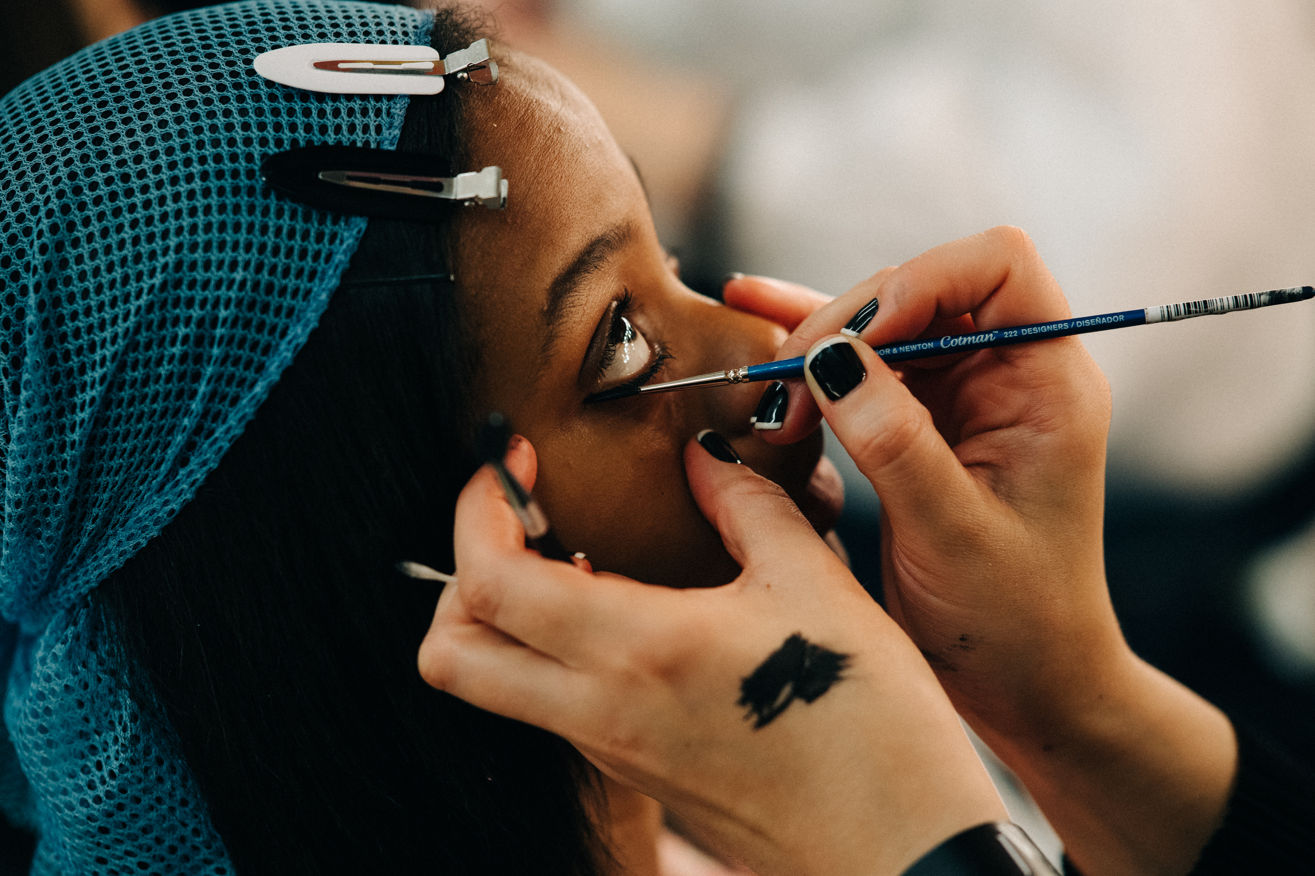 Model getting hair and make up done
