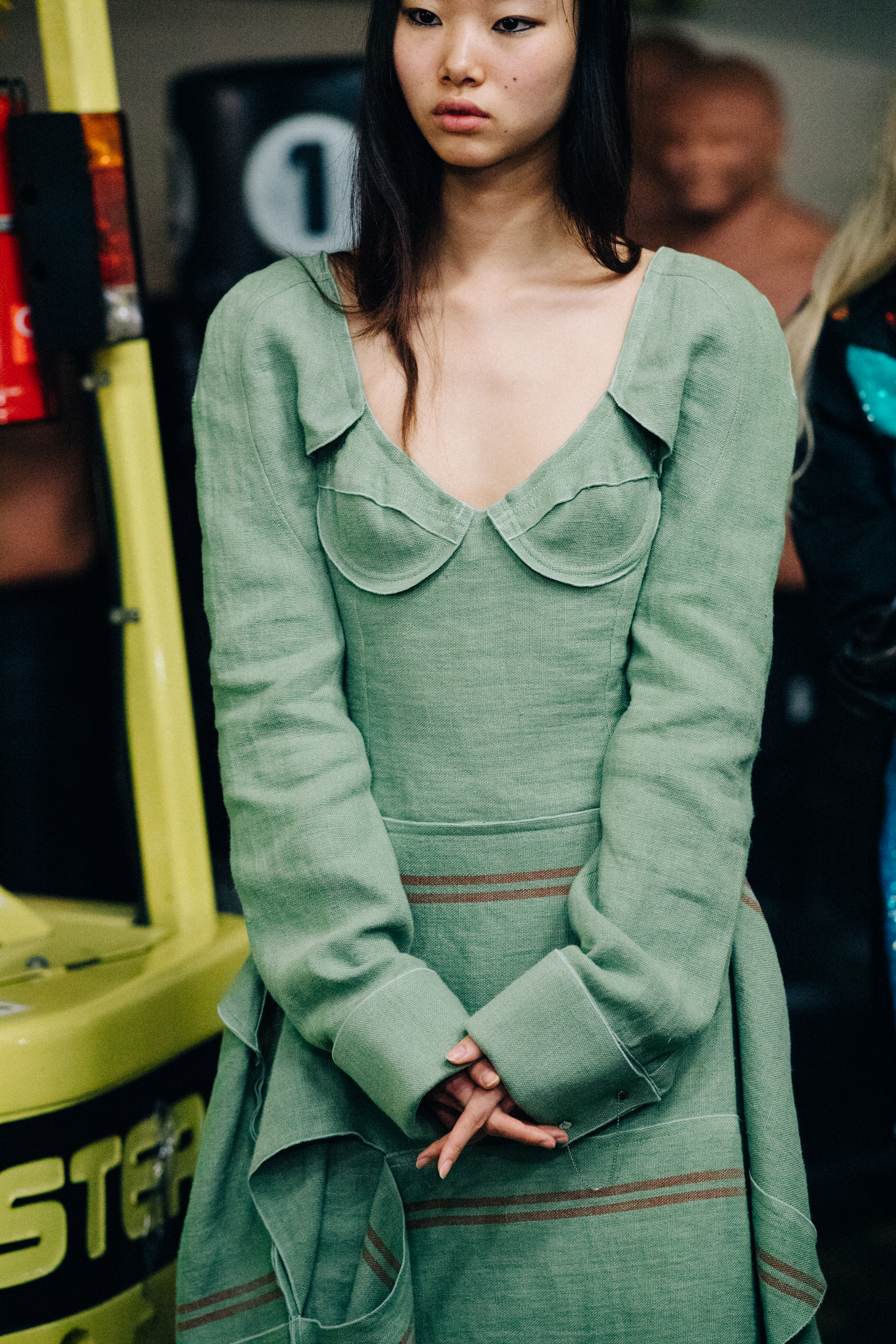 Model wearing dress before a show