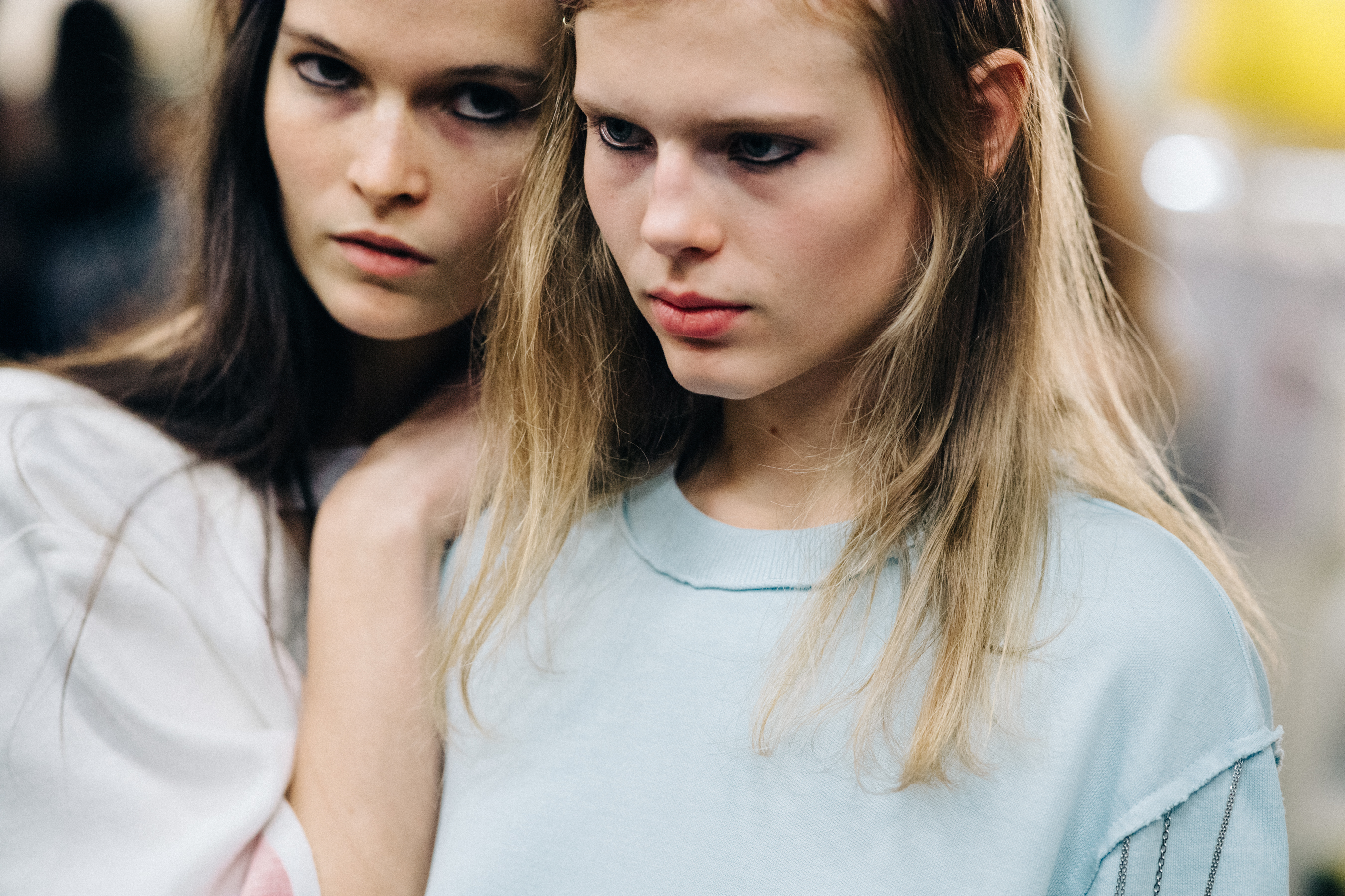 Model wearing colourful garments before a show