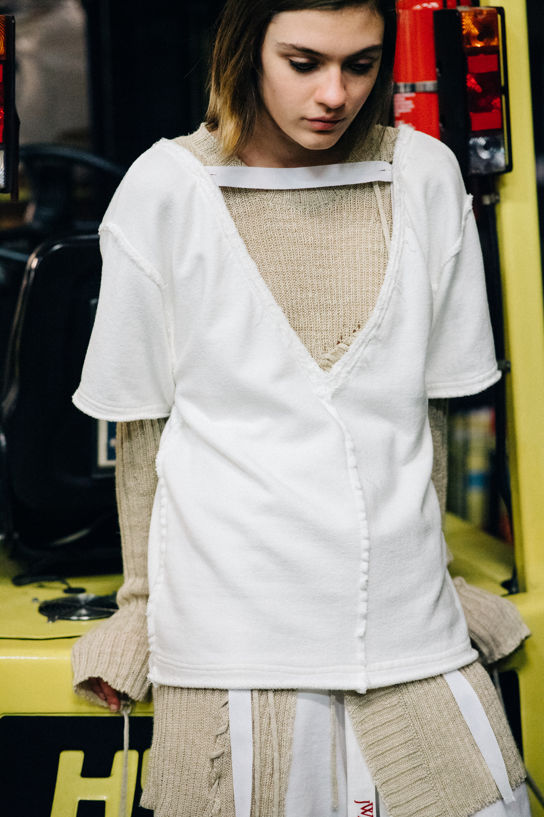 Model wearing dress before a show