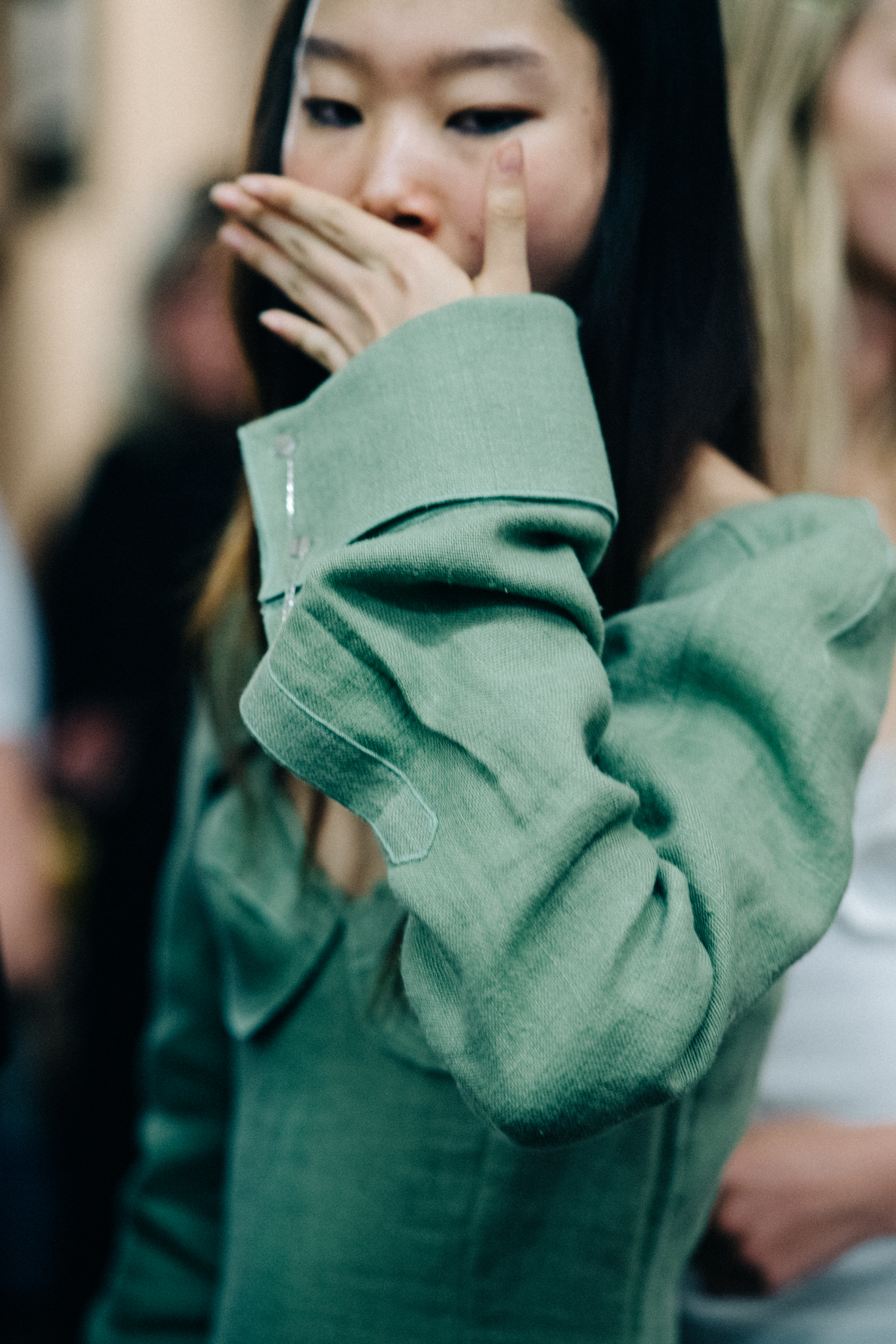 Model wearing dress before a show