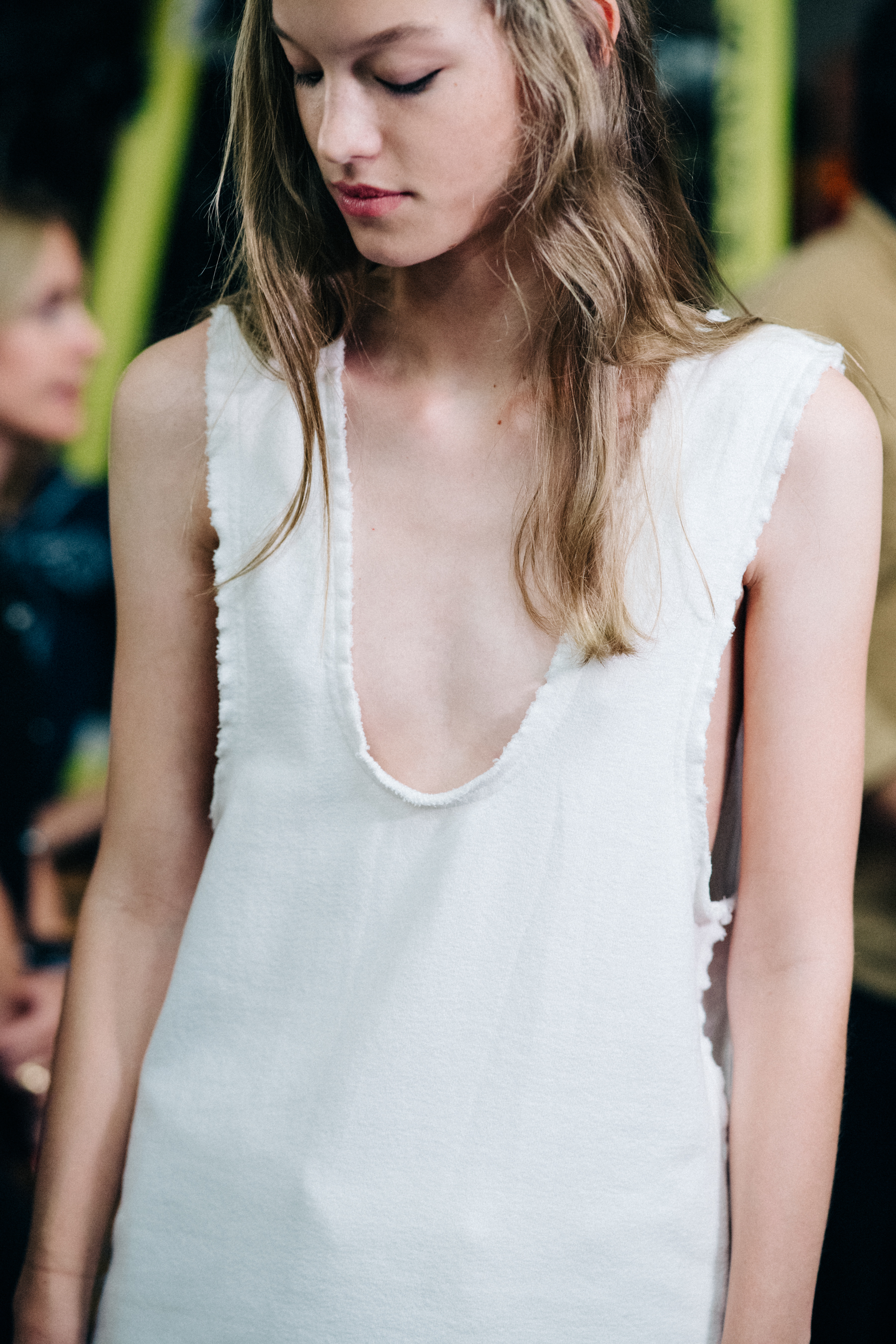 Model wearing dress before a show