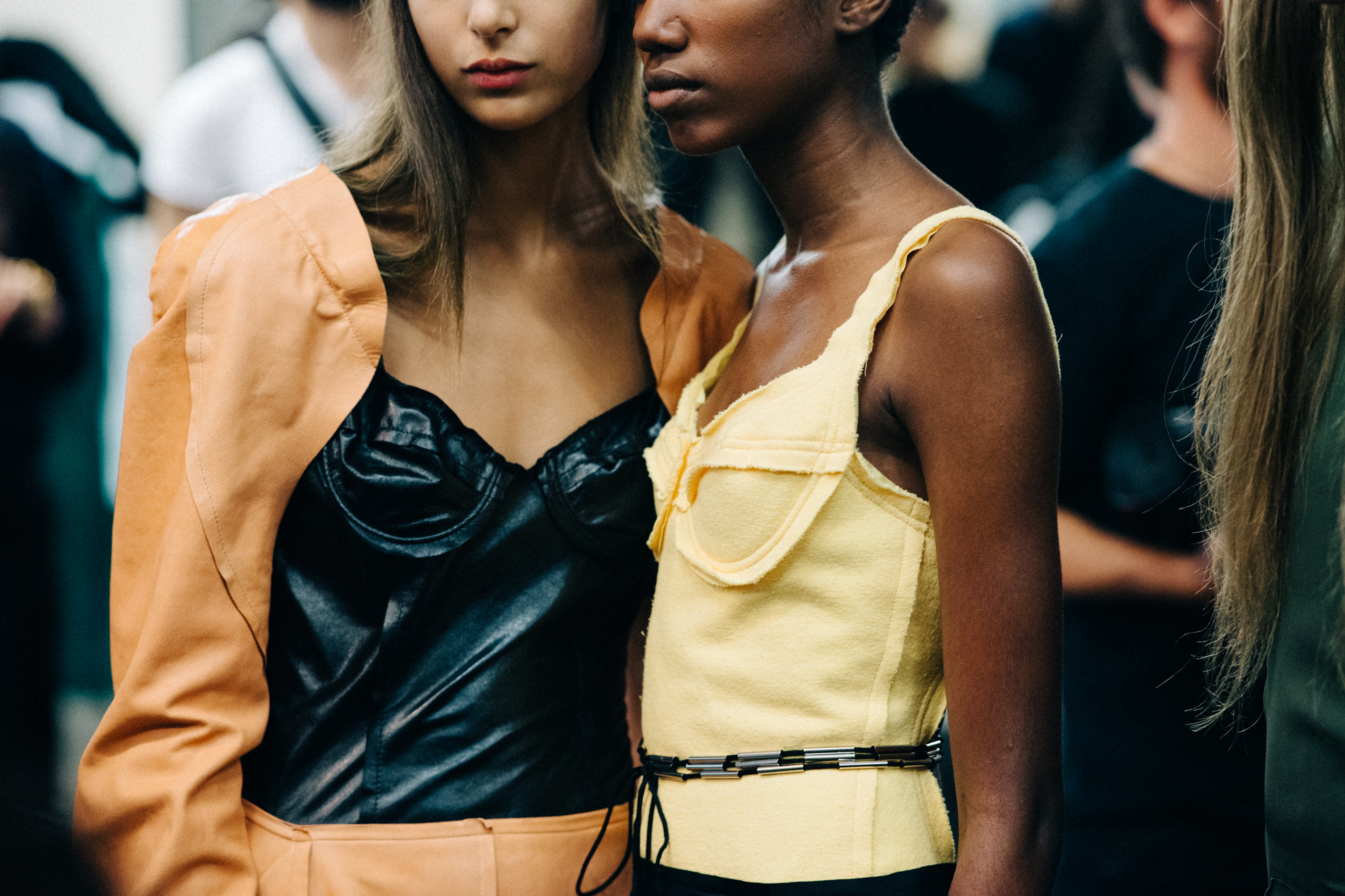 Model wearing colourful garments before a show