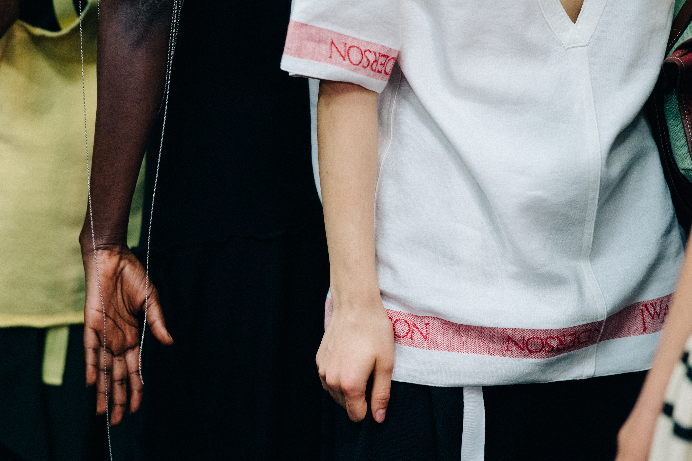 Model wearing colourful garments before a show