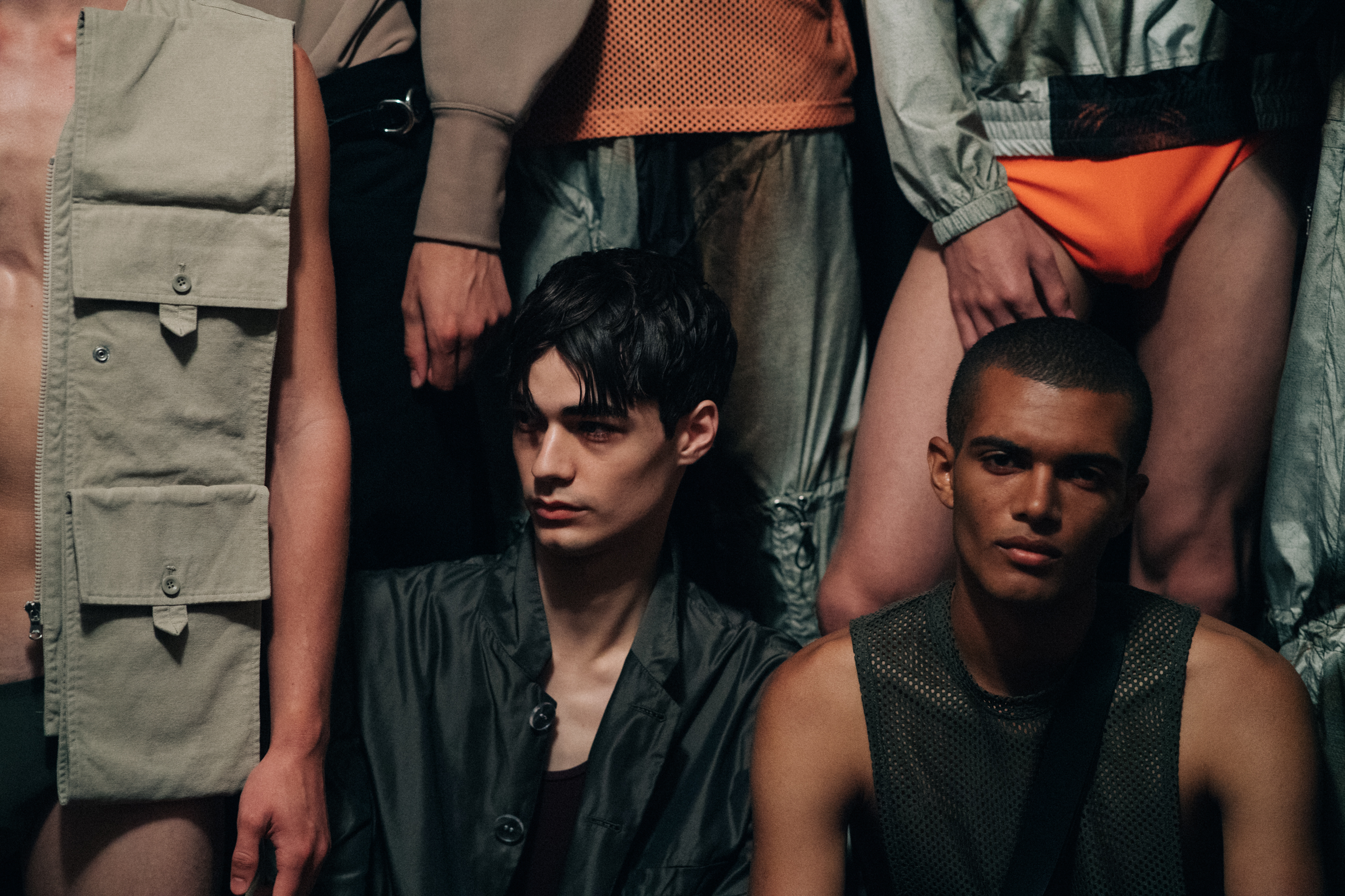 Group of male models before a show