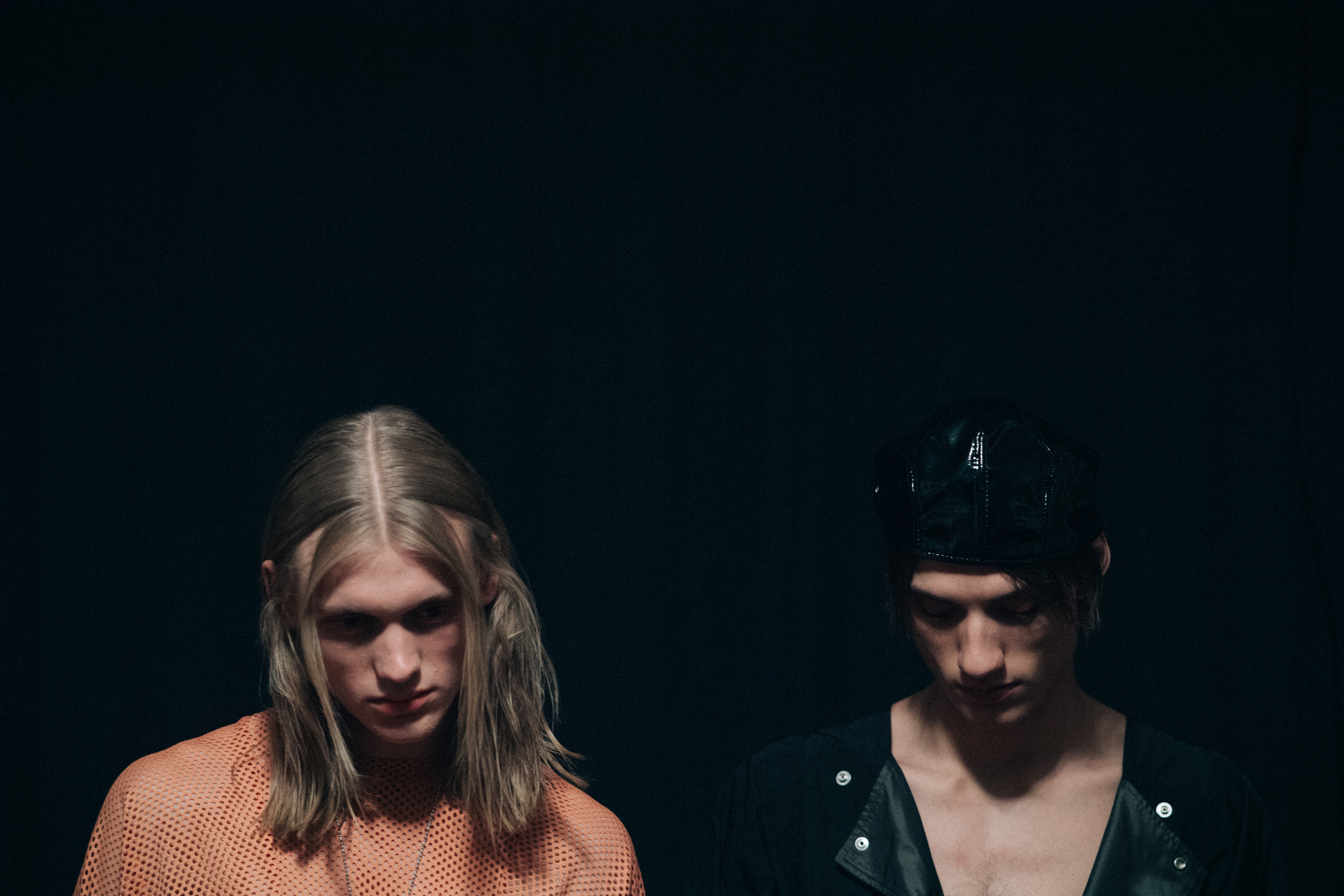 Two male models with long hair
