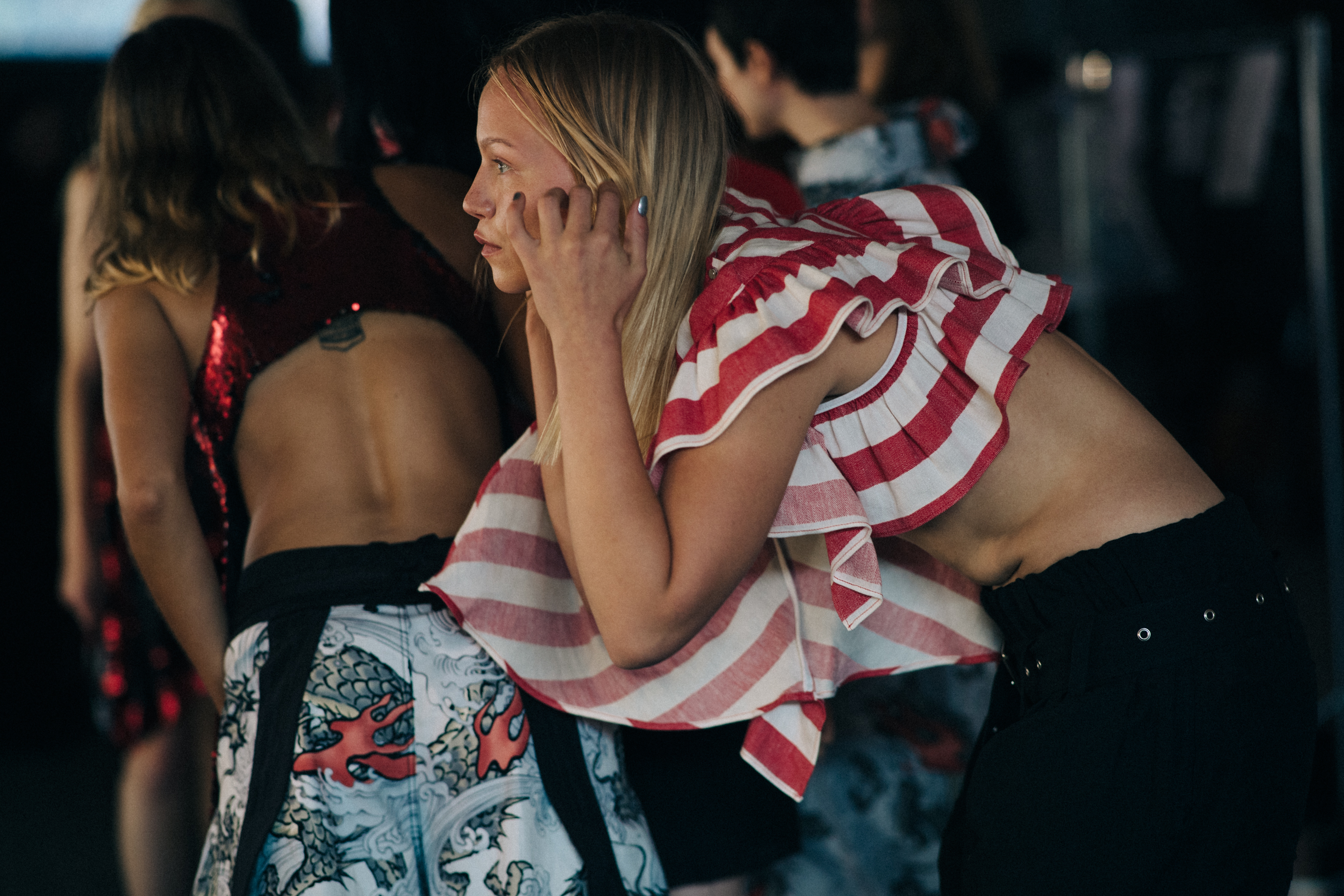 Model wearing red top with stripes