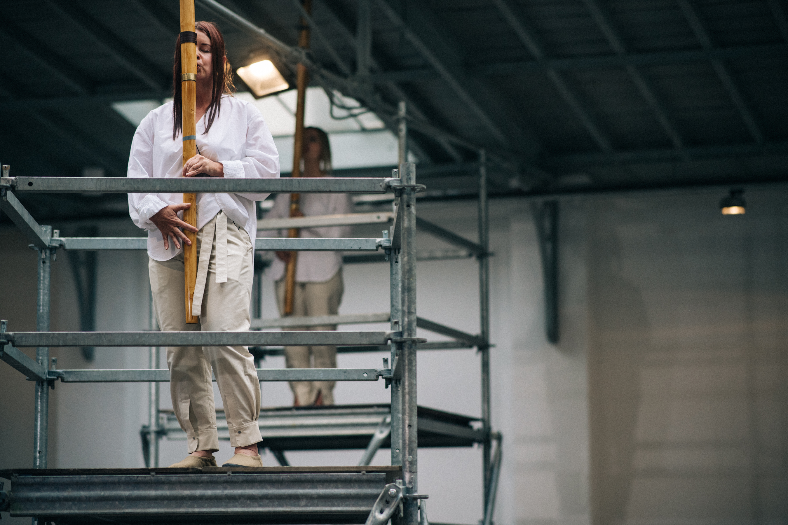 Singer at the top of a scaffolding