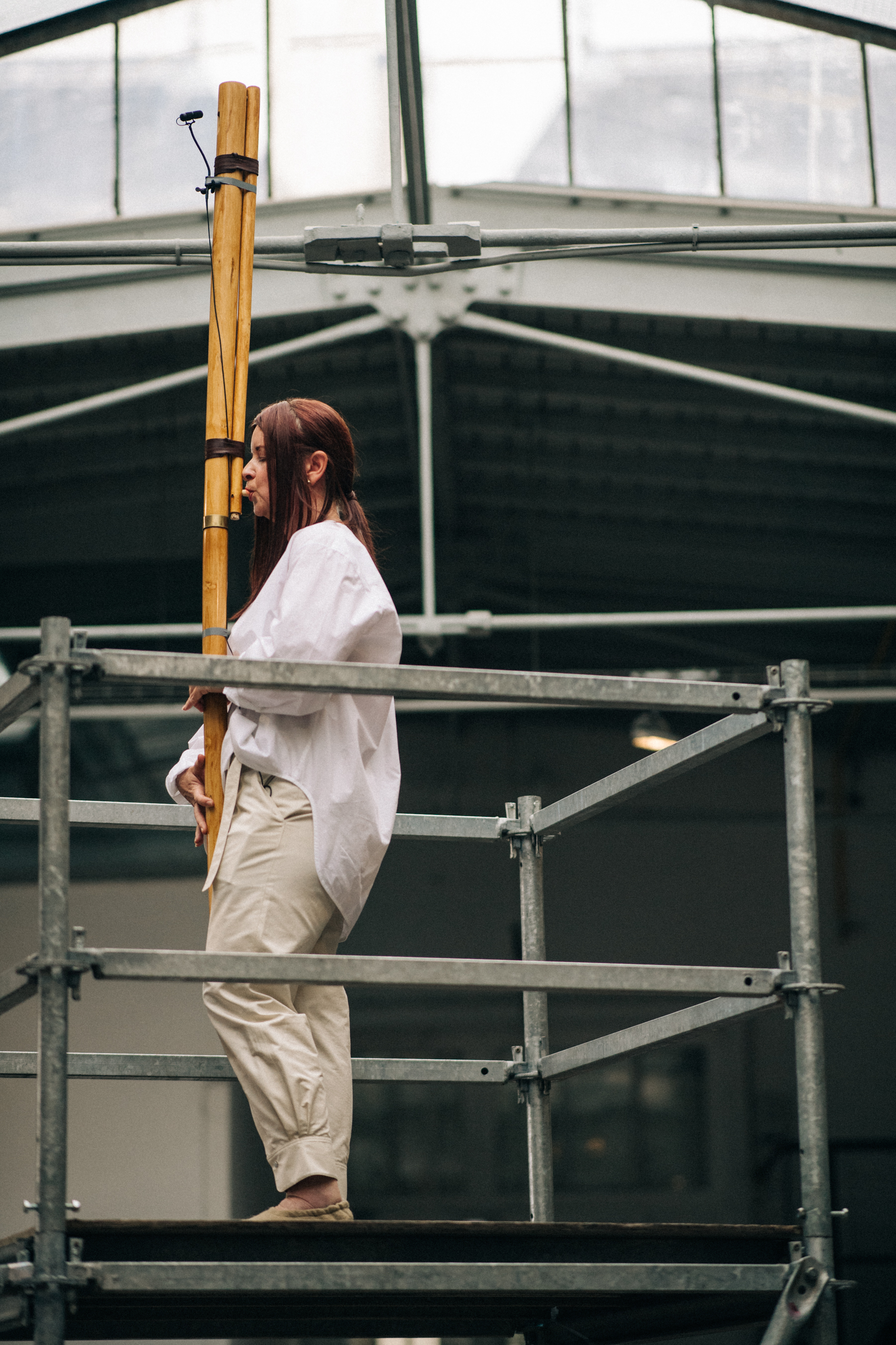 Singer at the top of a scaffolding