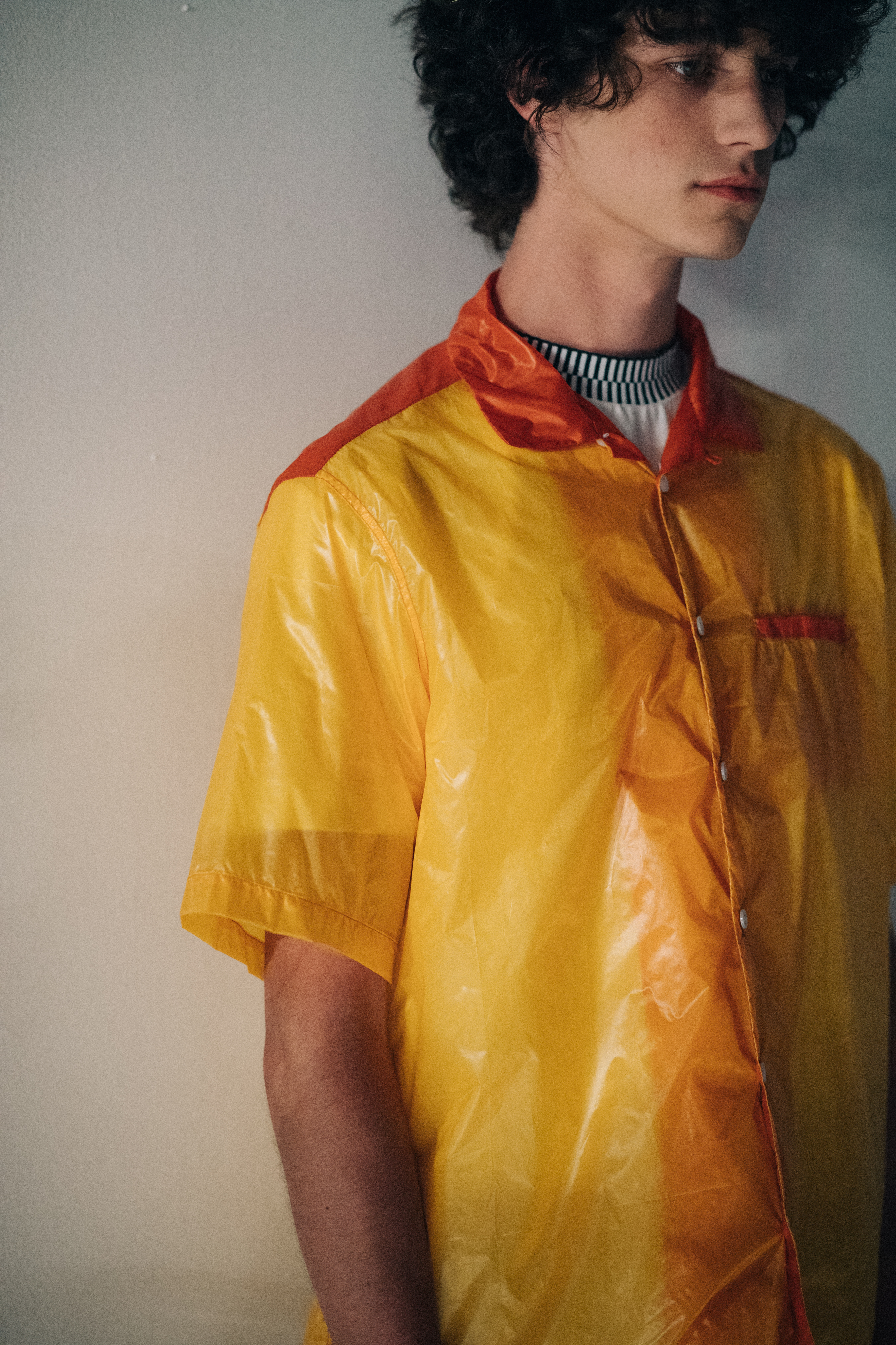 Male model wearing orange outfit