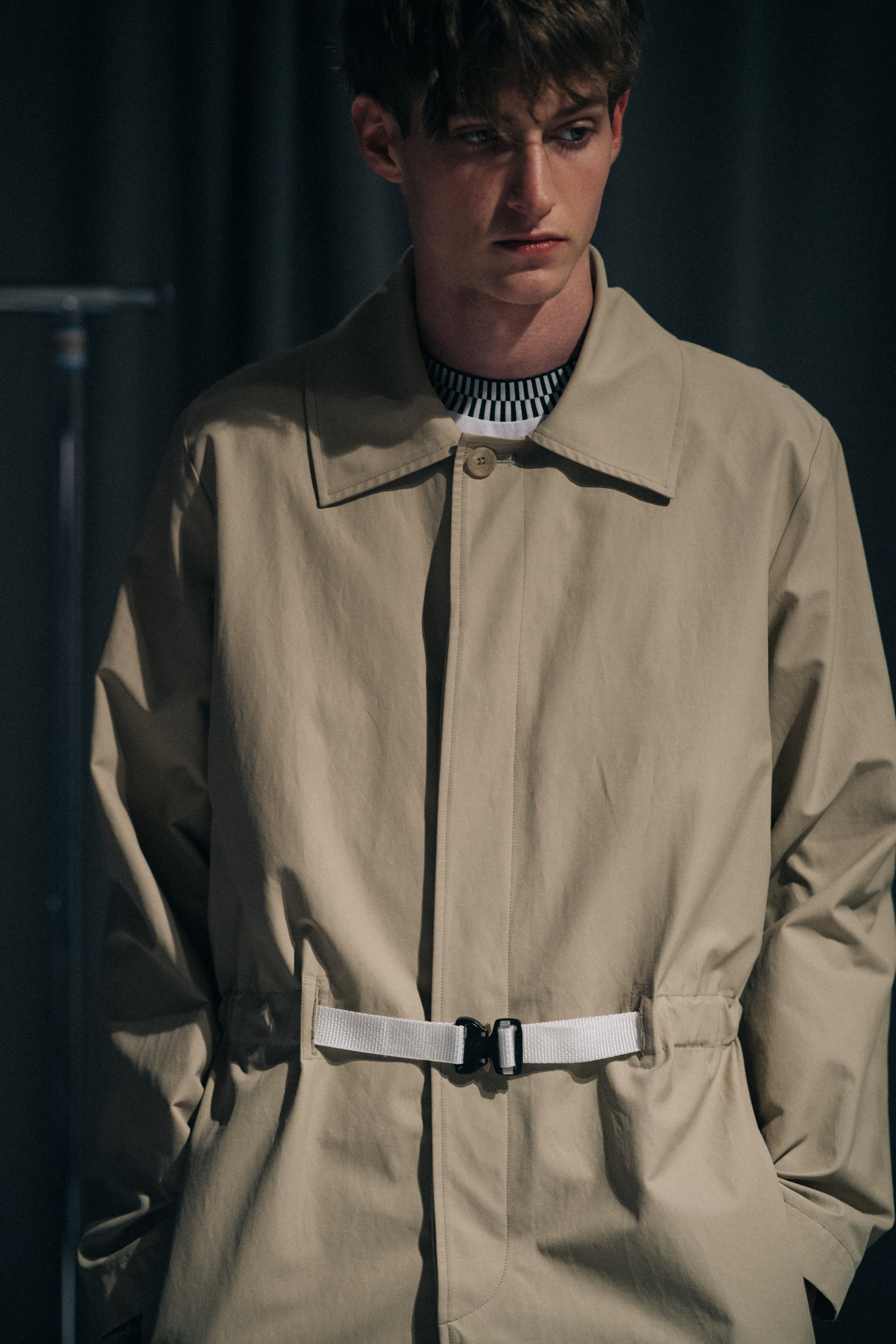 Male model wearing beige trench coat
