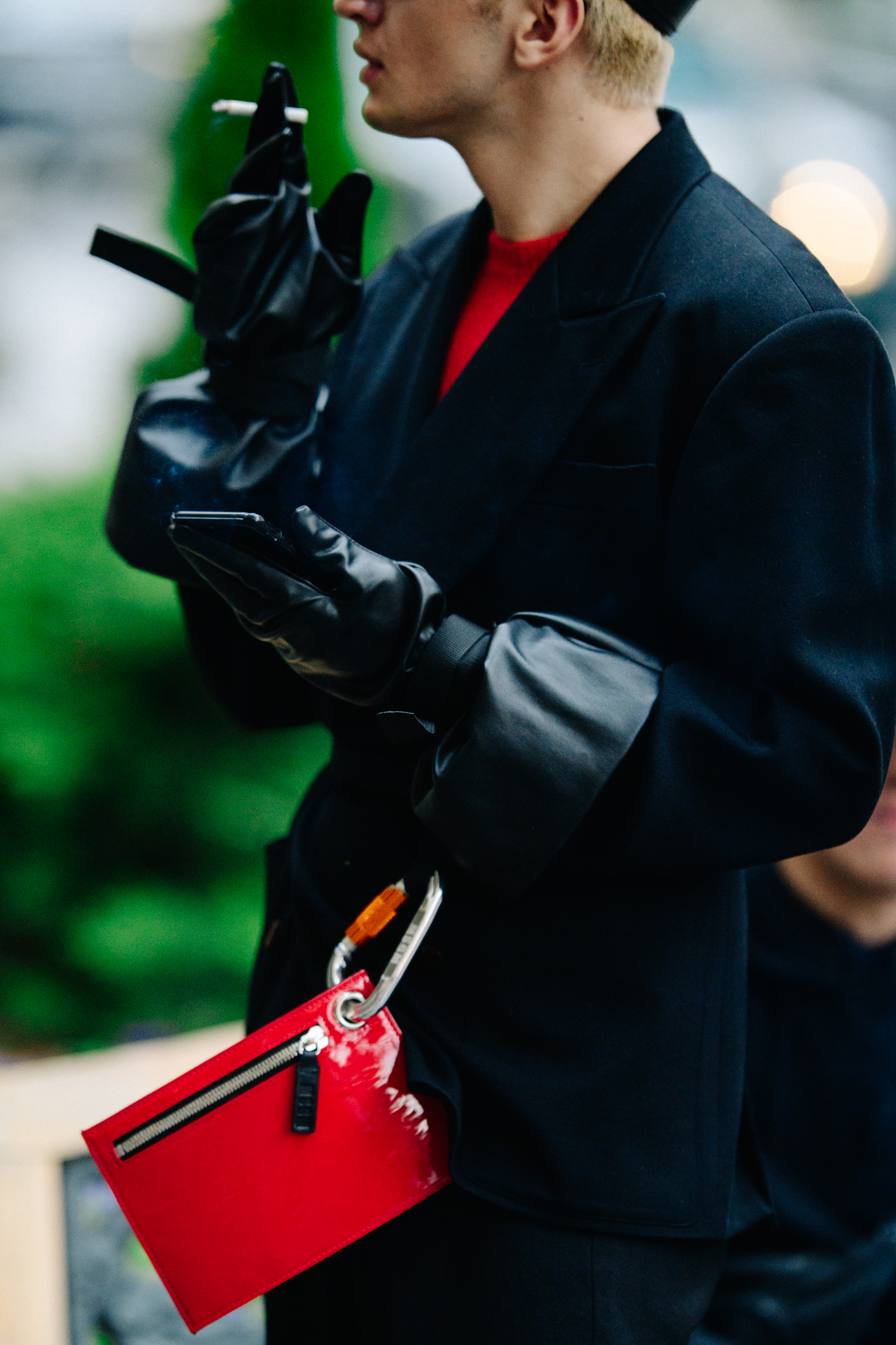 Man smoking in black outfit