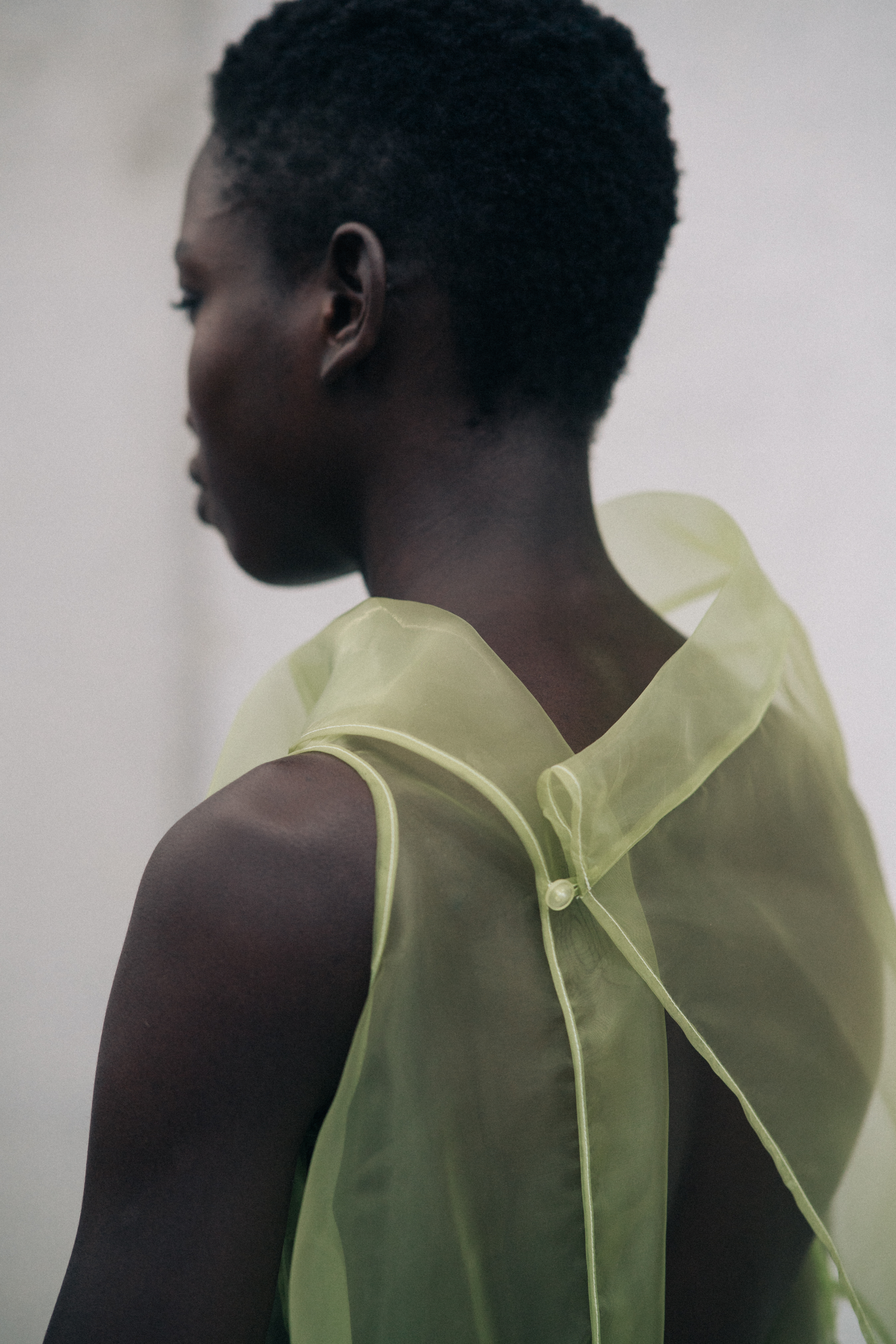 Model wearing transparent clothes before a show
