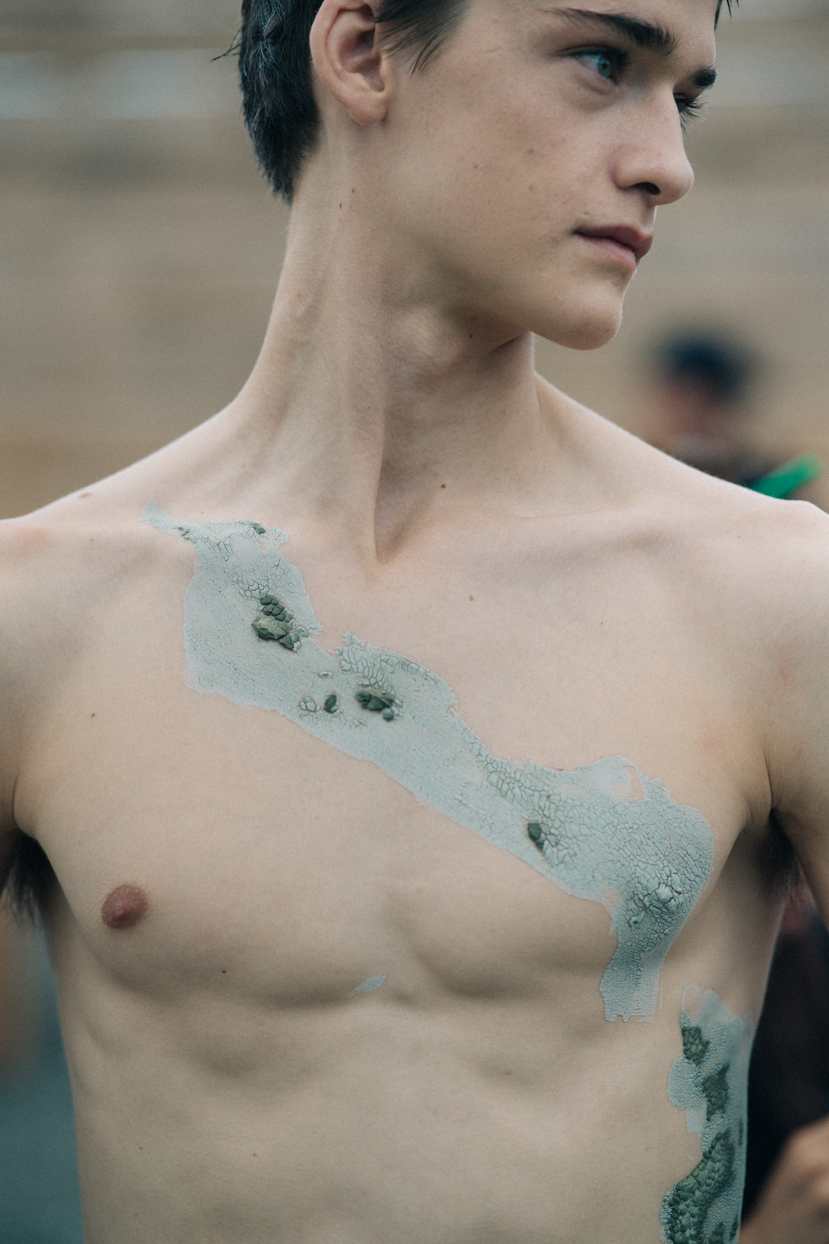Male model with muddy body paint