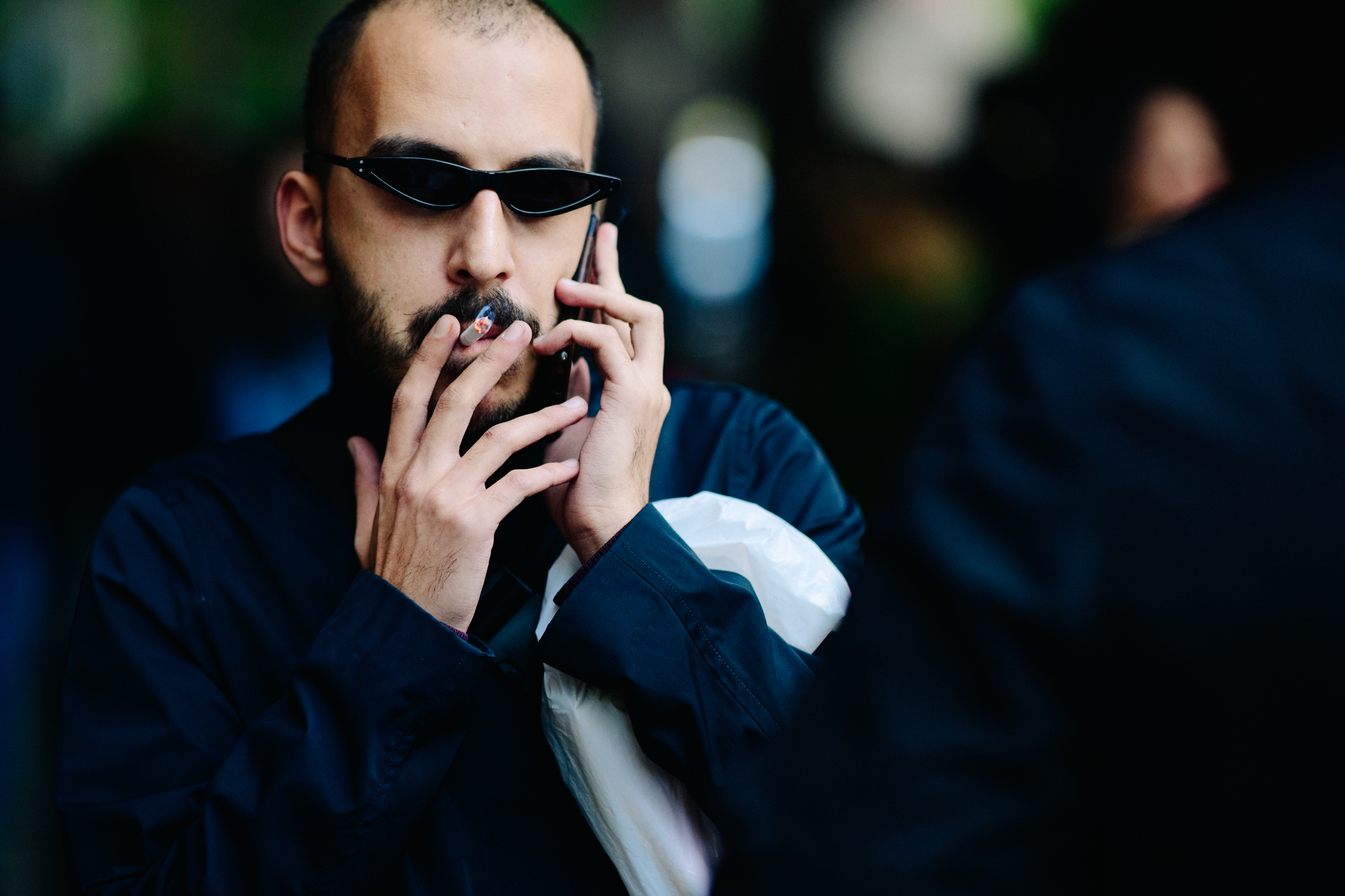 Man smoking with black sunglasses