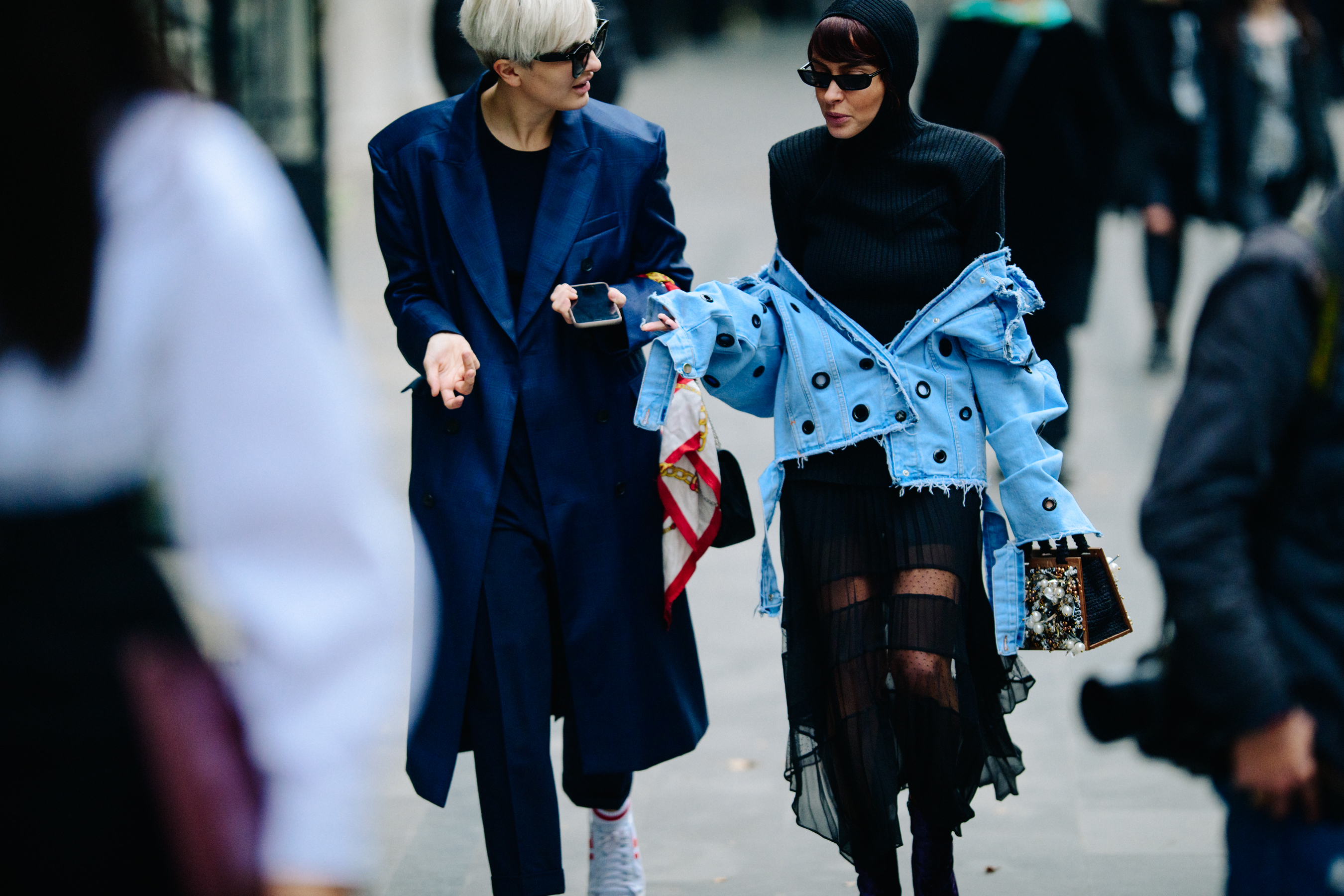 Women wearing black and blue outfits