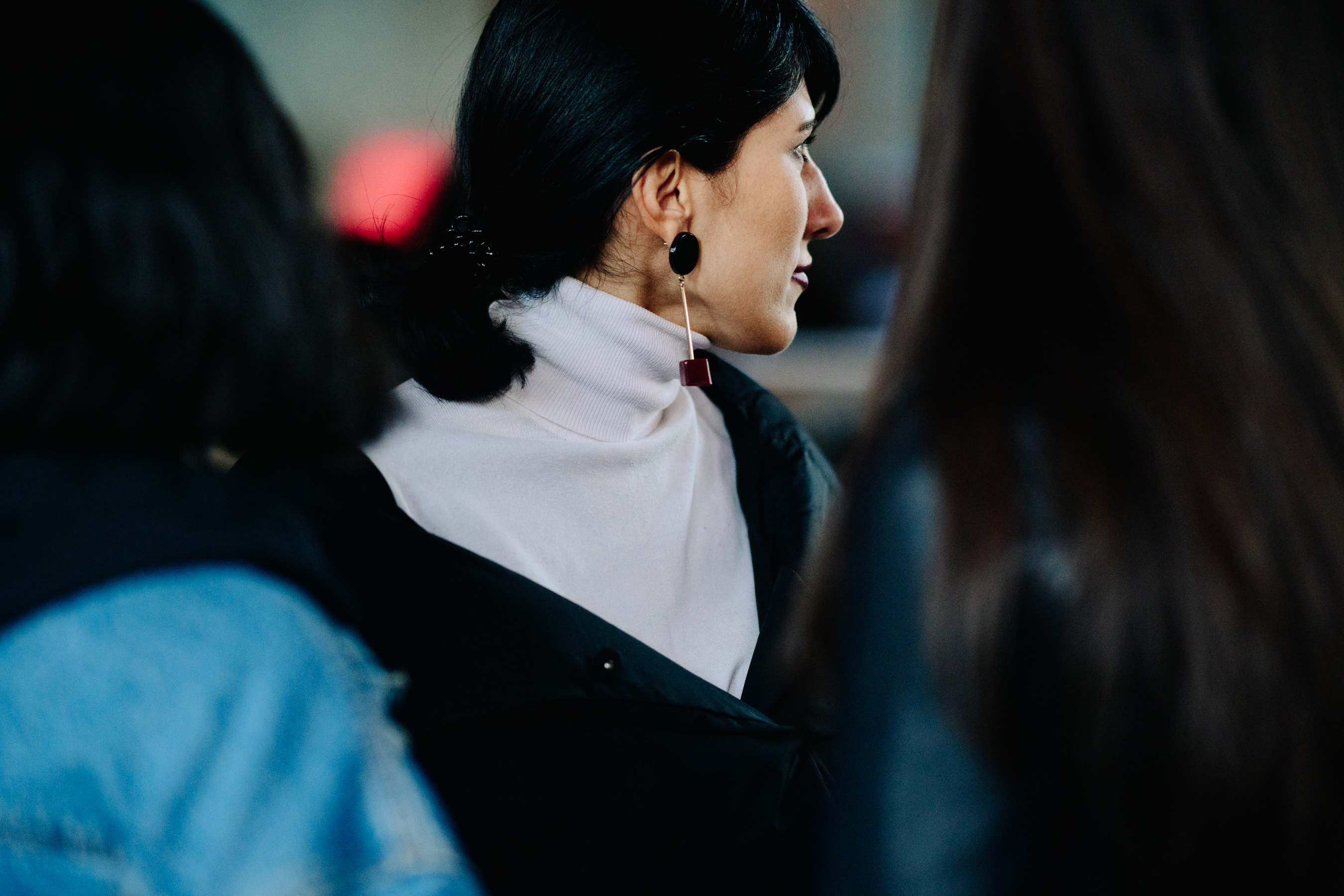 Woman with long metal earring