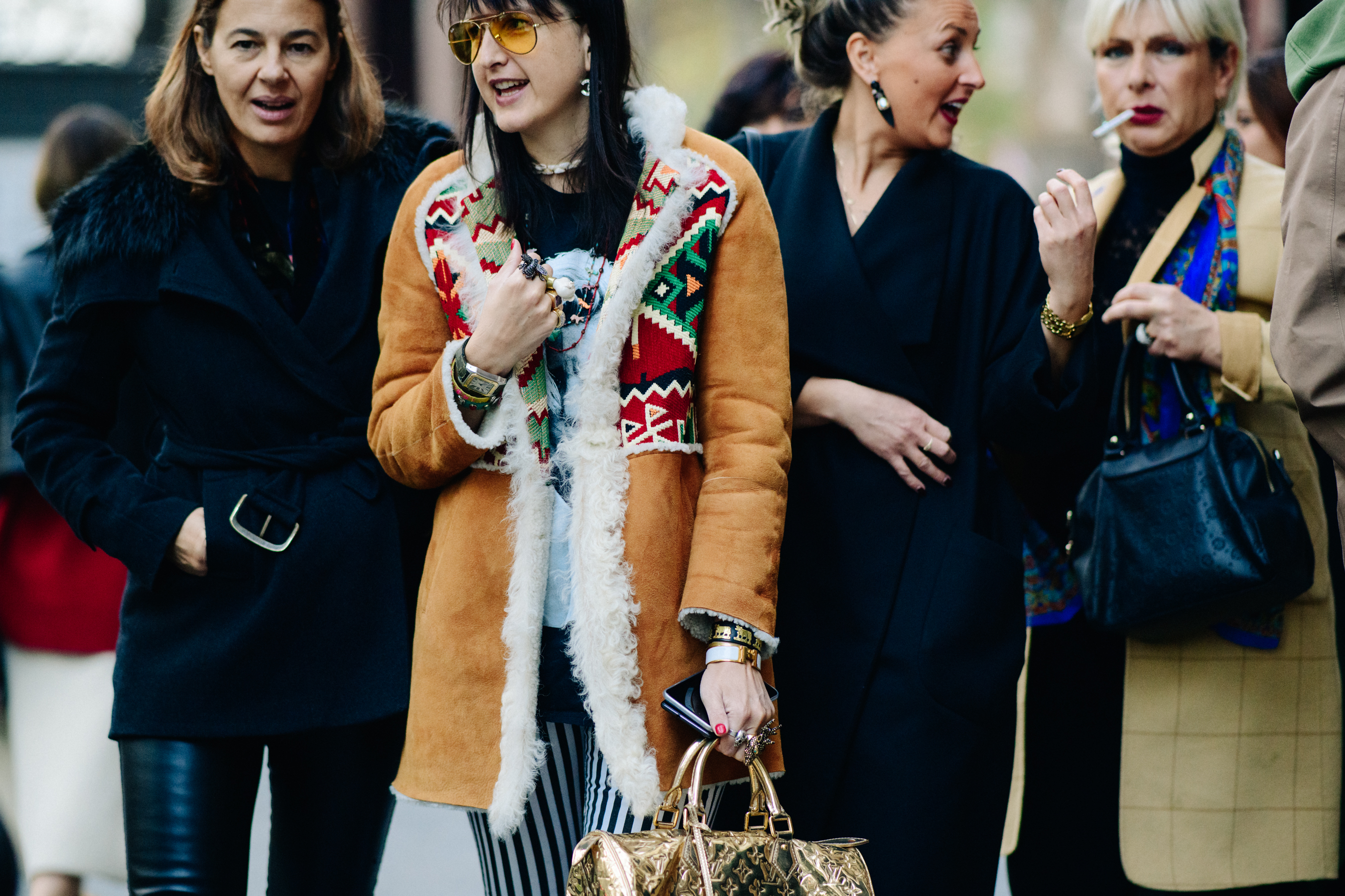 Four girls wearing winter coats